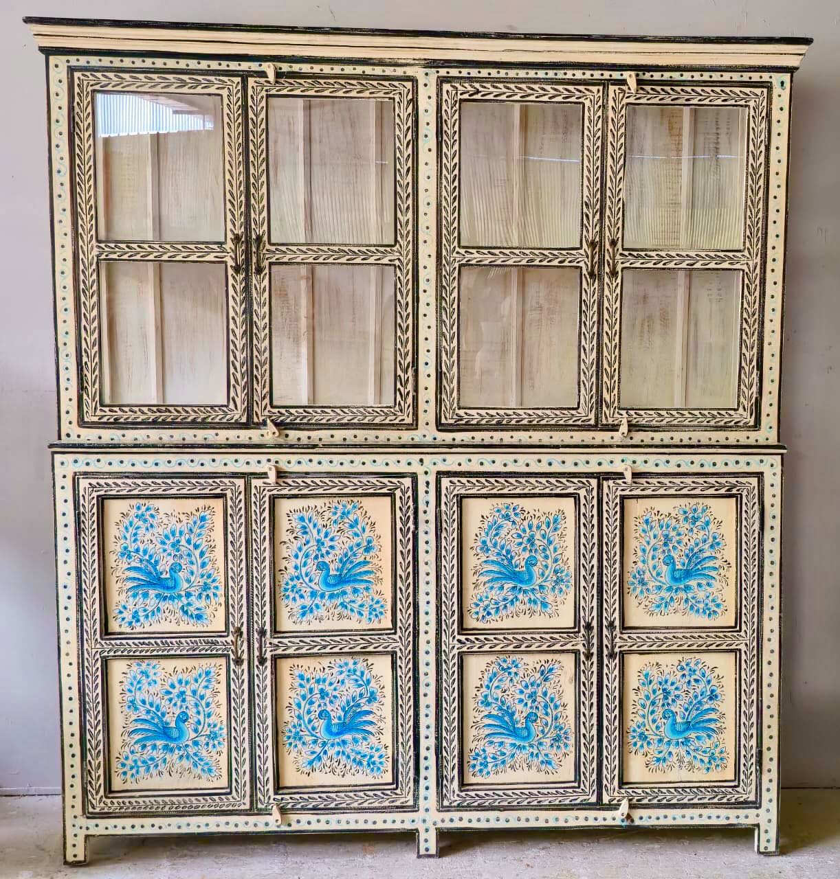 Hand-painted reclaimed wood display cabinet with glass doors and floral blue peacock design – Aadrika model by Om Home & Garden