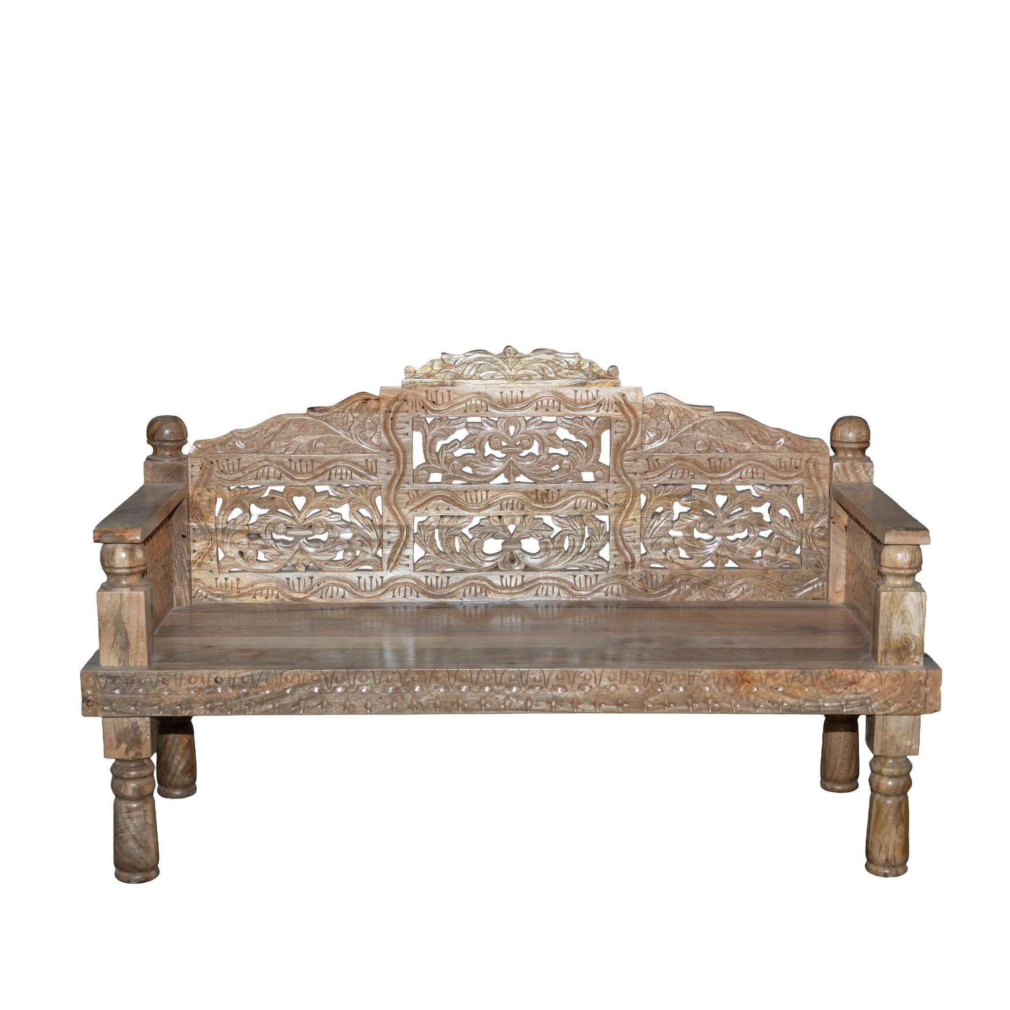 White background image of a hand carved mango wood bench, featuring intricate floral detailing and turned legs, representing traditional Indian craftsmanship and authentic hand carved wooden furniture design.