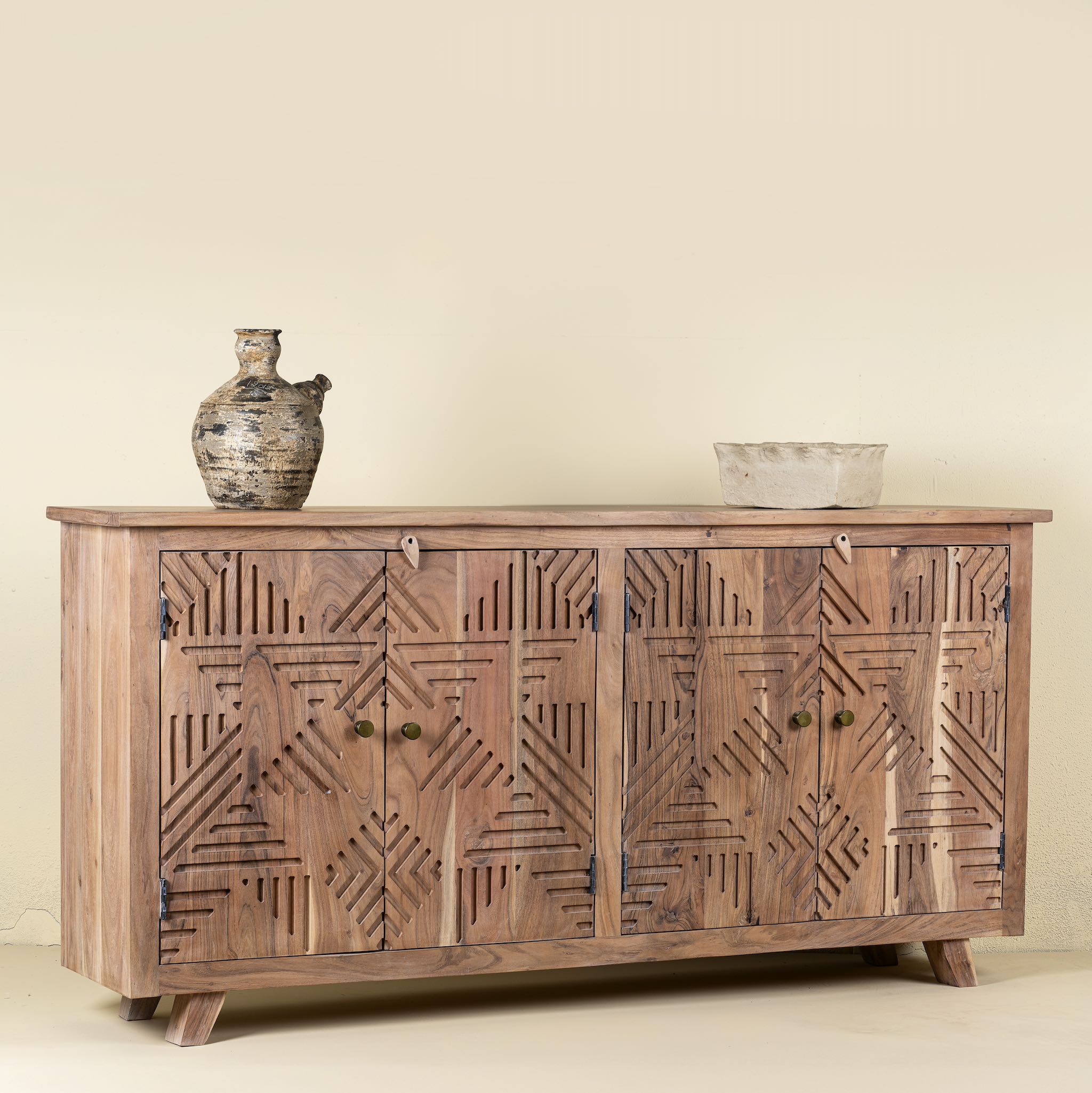 Side view of a Acacia wood furniture sideboard with hand-carved detailing and brass knobs, modern living room furniture, 180 × 40 × 90 cm.