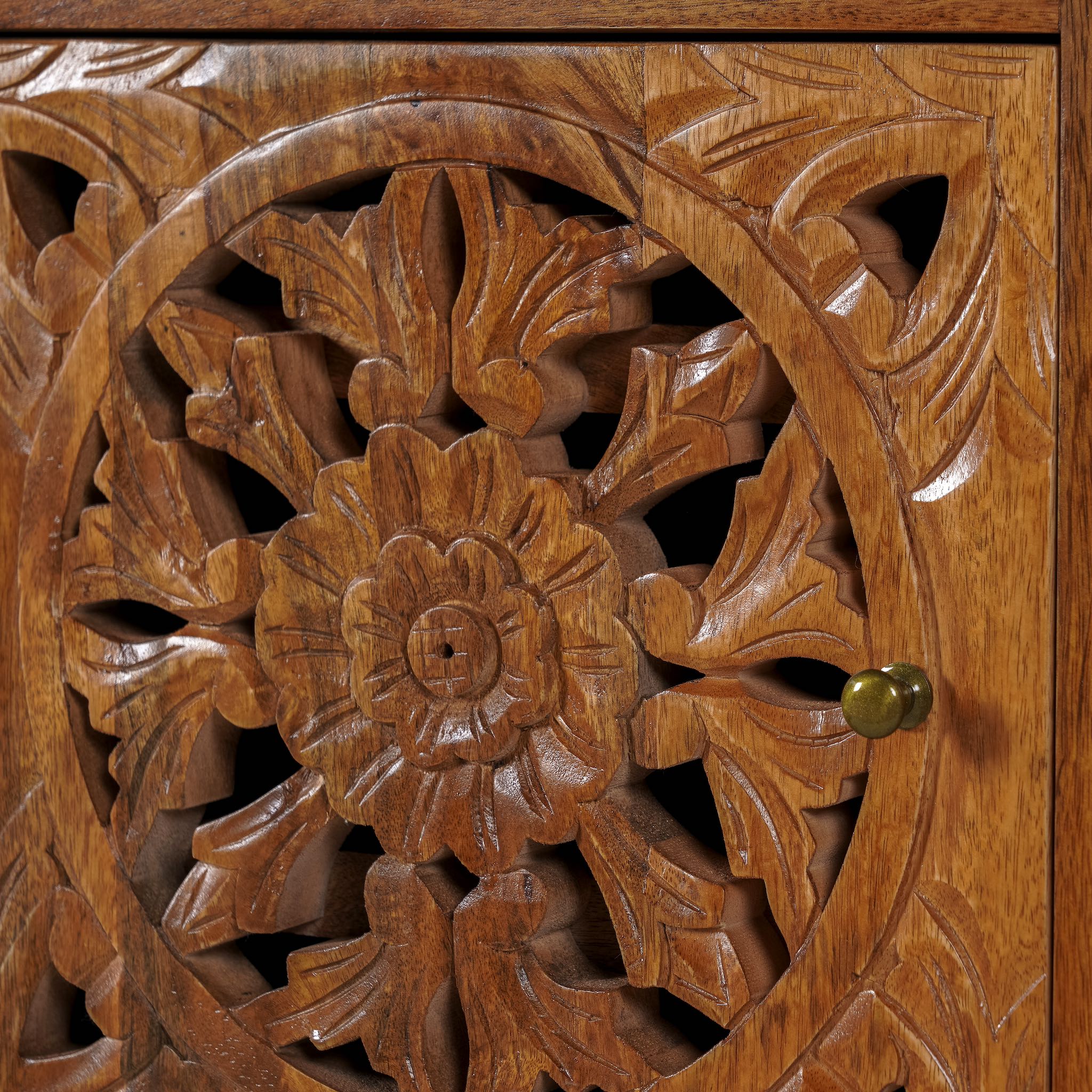 Close up image of a pair of pair of mango wood night stands with hand carved floral and geometric detailing, warm teak finish; elegant hand carved furniture, 45 × 35 × 65 cm.