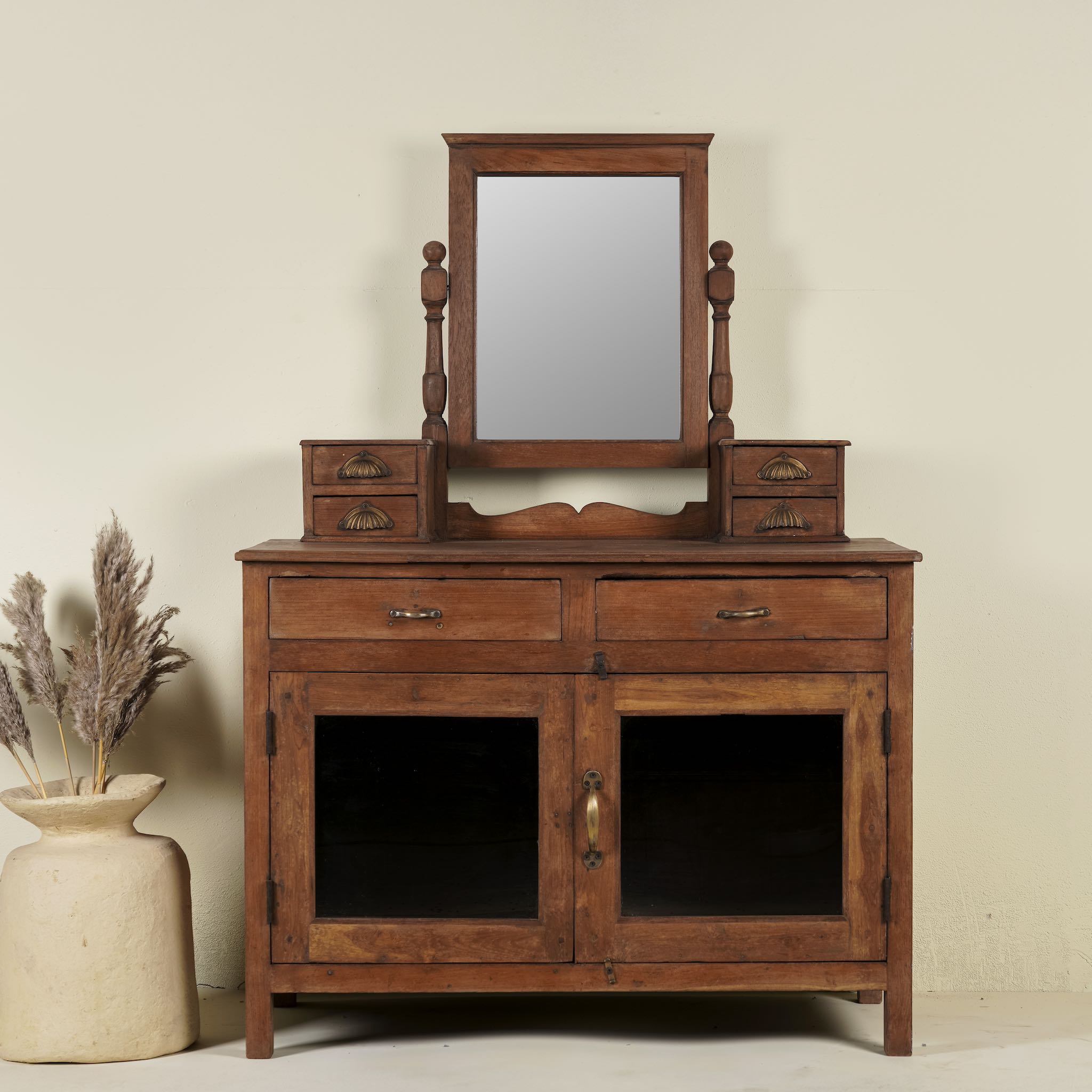 Restored antique cosmetic table in teak wood with hand-carved details; teak wood furniture for bohemian interiors, 105 × 56 × 148 cm.