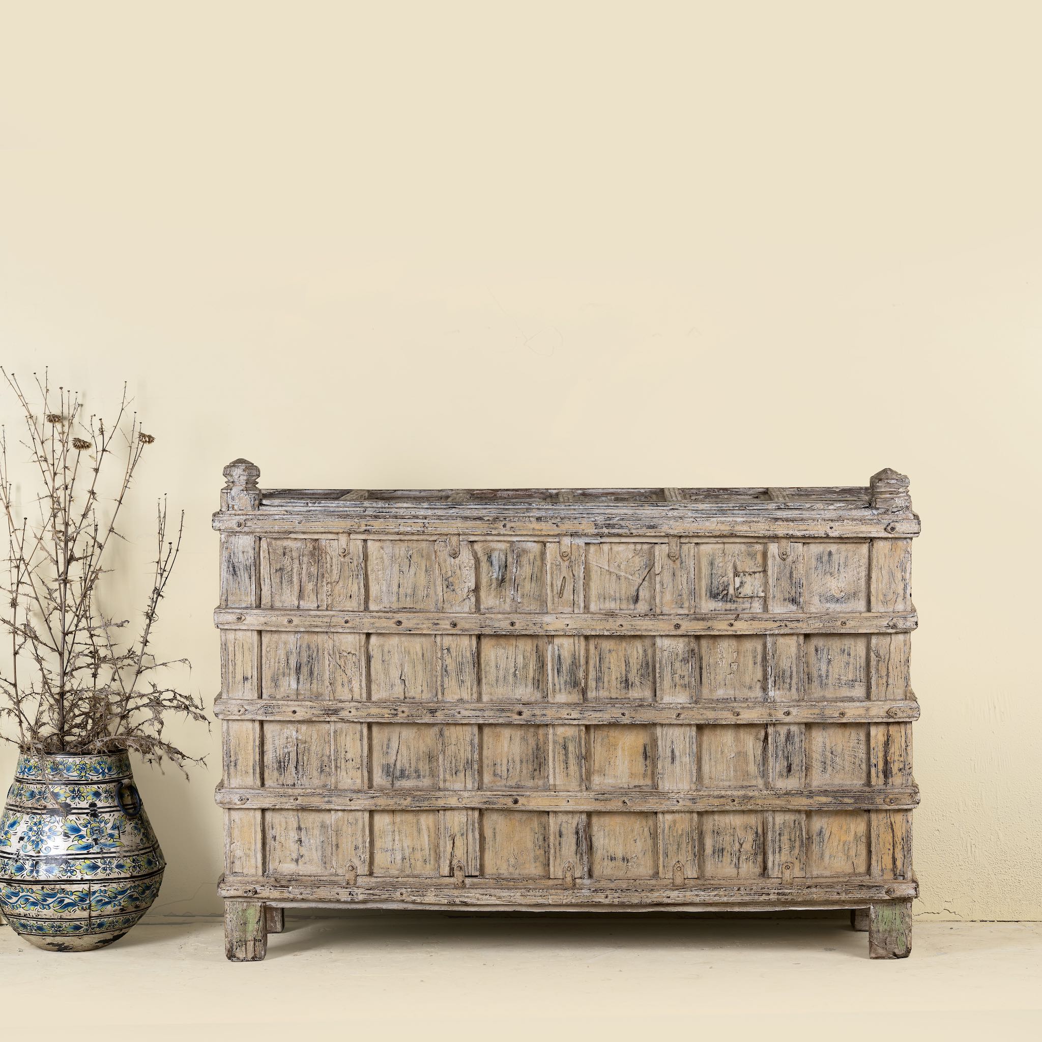 Unique Indian furniture teak counter table with vintage shelving and aged green paint, antique console with original wood panel detailing, 152 × 64 × 102 cm.