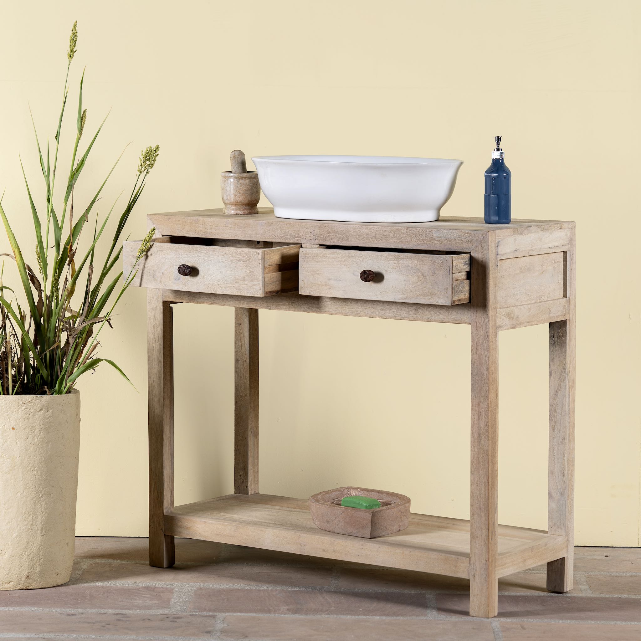 Image with open drawers of a Ibiza style reclaimed wood console table with two drawers and a lower shelf, whitewashed finish, 100 × 40 × 90 cm.