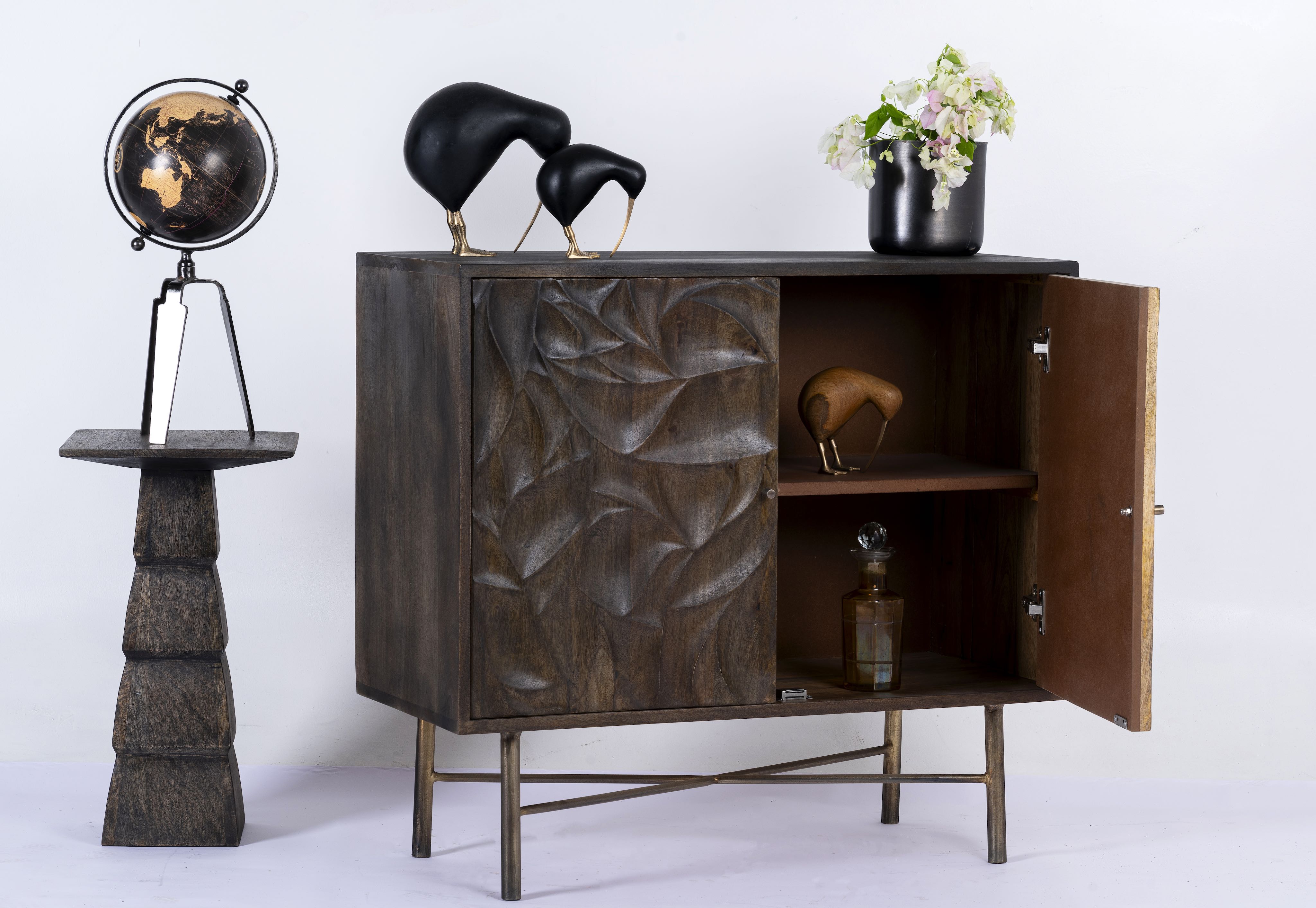 Side angle image with open doors of a hand-carved mango wood sideboard with brass-plated iron stand—an artisanal, minimalistic furniture piece combining natural warmth and modern elegance.