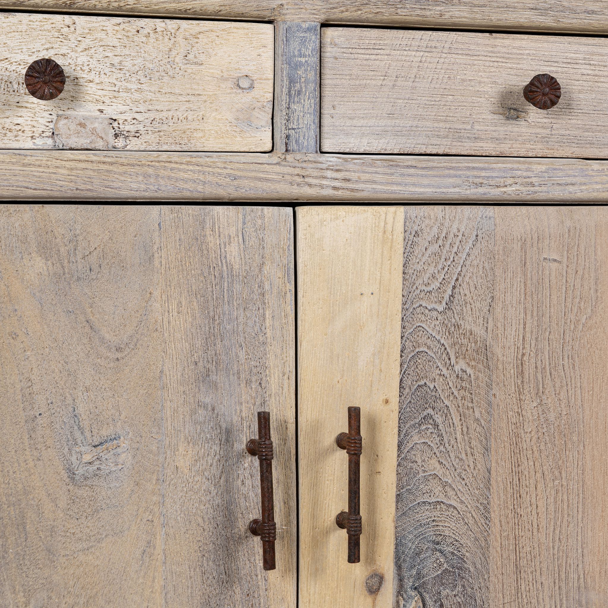 Close up image of a reclaimed wood cupboard with 2 drawers and 2 doors, rustic finish; sustainable bathroom furniture, 90 × 50 × 80 cm.