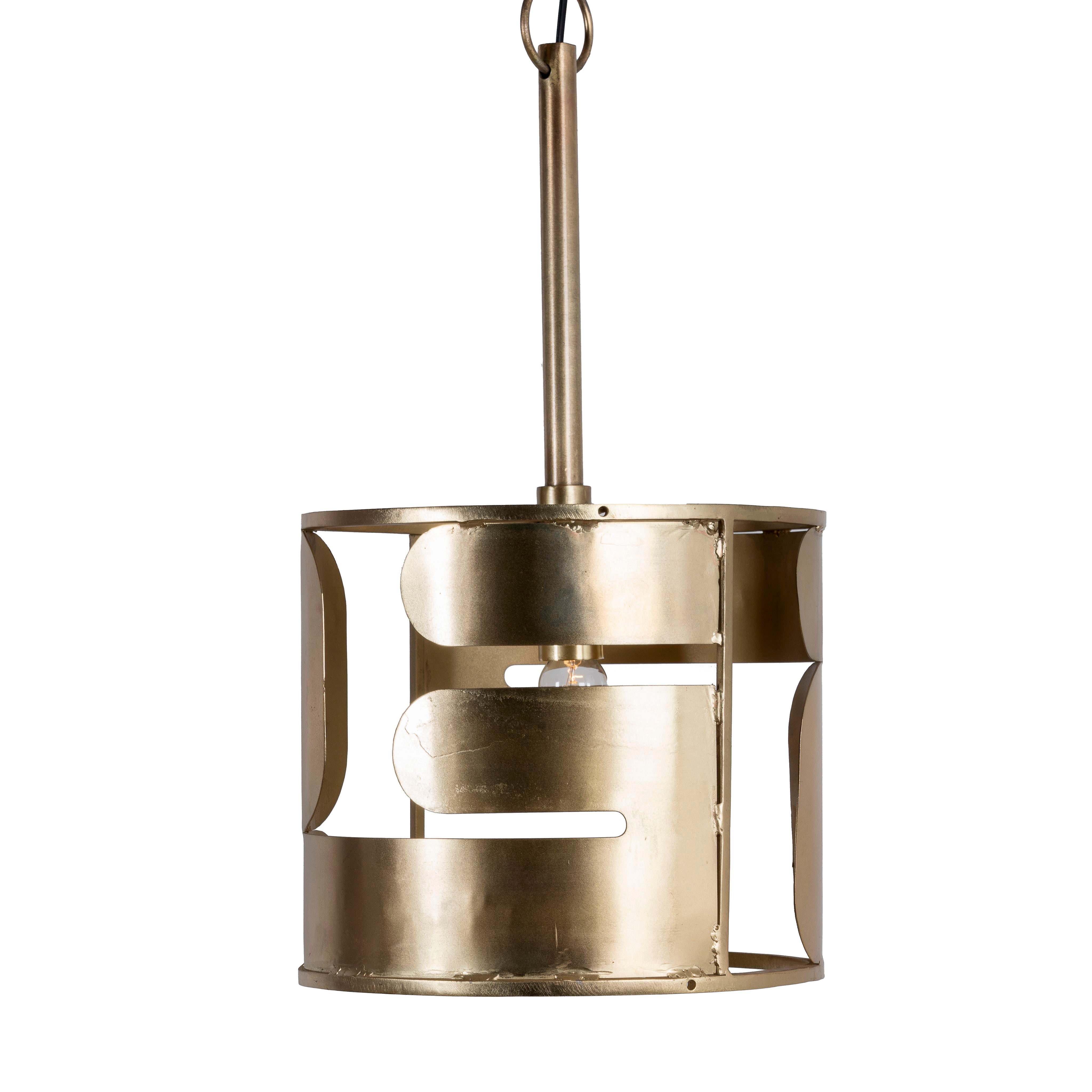 White background image of a medium round brass-plated metal pendant lamp with geometric cutout design – a modern take on vintage lights perfect for dining rooms, kitchens, or stylish living areas.