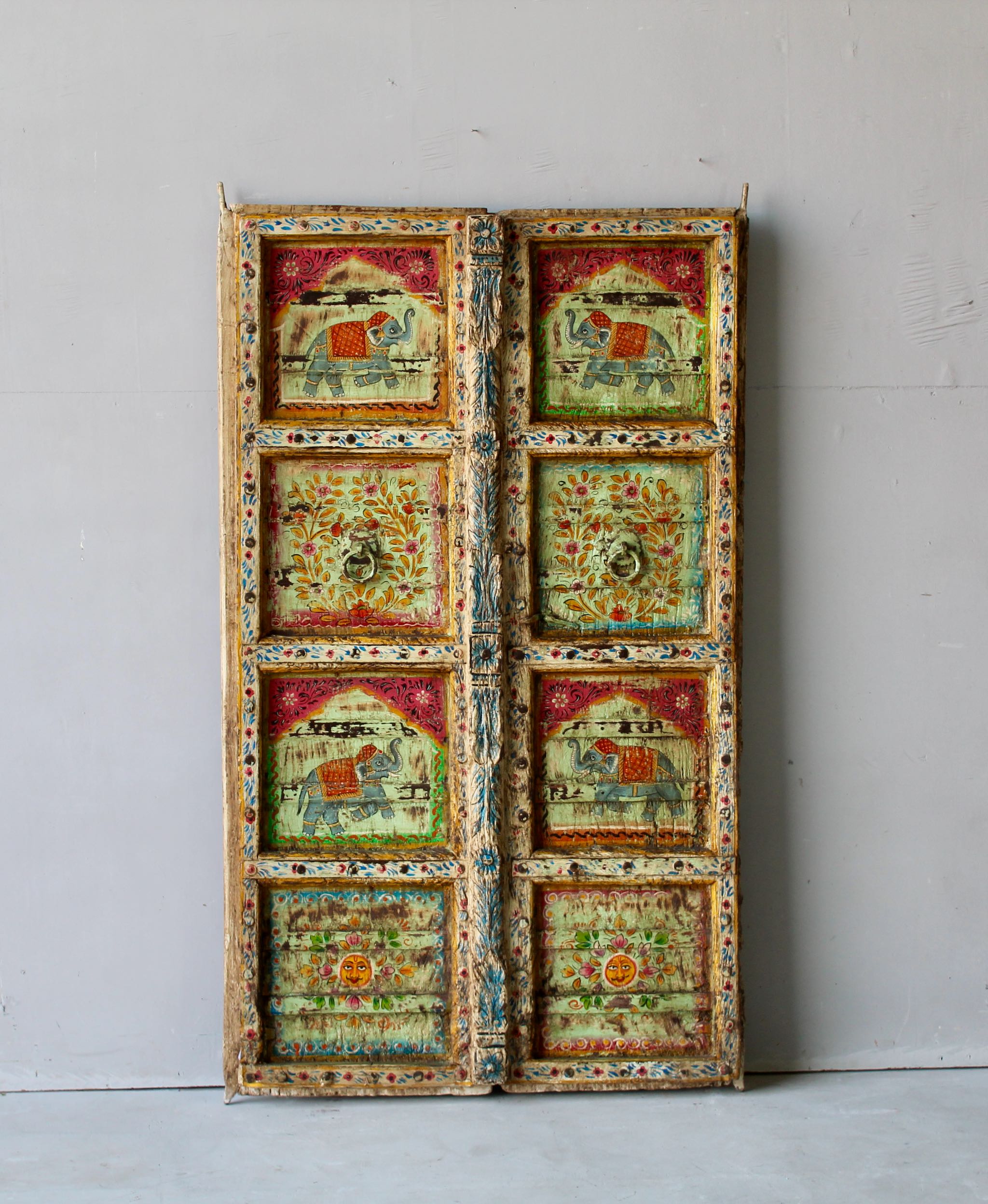 Hand-painted Indian antique teak door with elephant and floral motifs, distressed green finish, vintage wall panels for unique home decor.