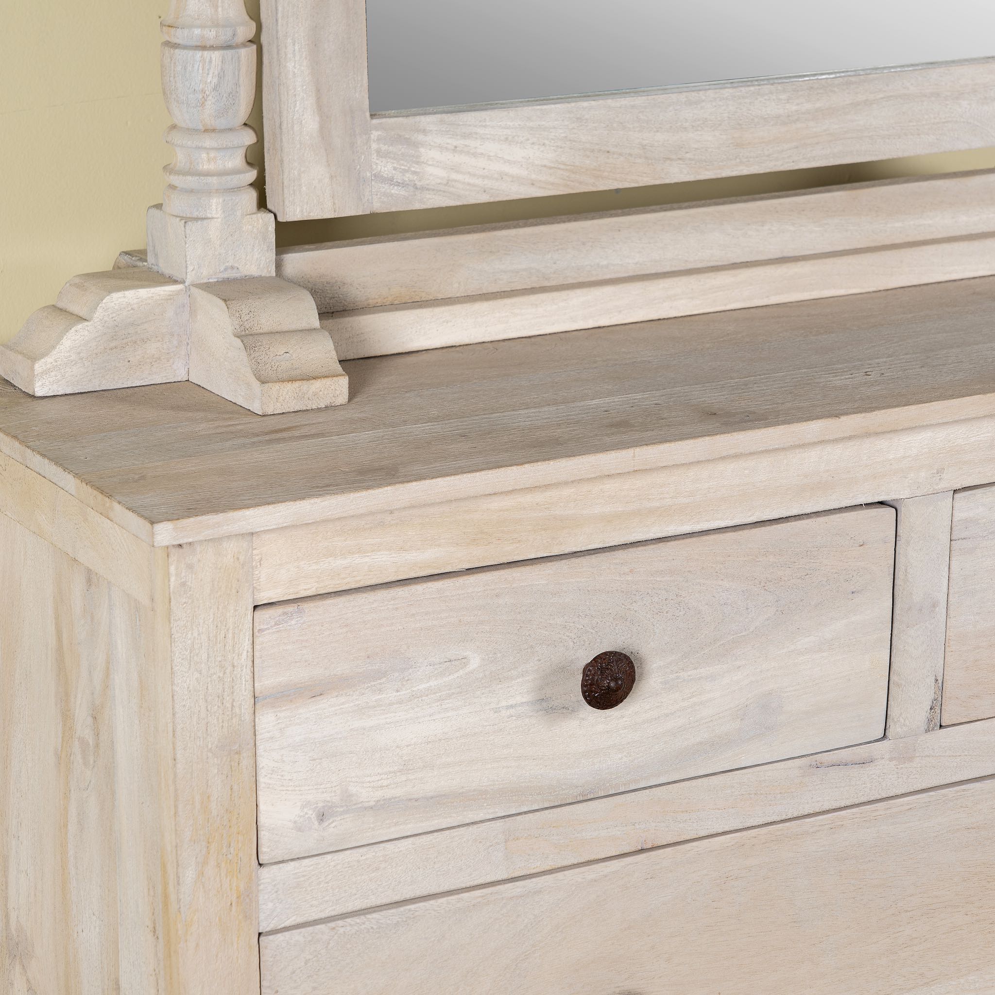Close up image of a Ibiza style Mango wood dressing table with five drawers and mirror, sandblasted whitewashed finish, 100 × 40 × 130 cm.