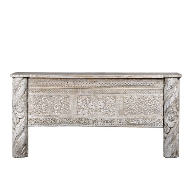 White background image of a white-washed carved console table made from reclaimed wood with floral detailing; Mediterranean and Ibiza style furniture, 160 × 80 × 48 cm.