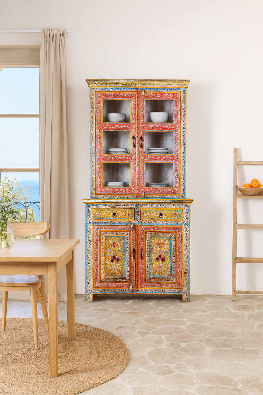 Lifestyle image of a hand-painted two-part showcase made of reclaimed wood with floral motifs; unique furniture for a boho chic living room, 94 × 48 × 203 cm.