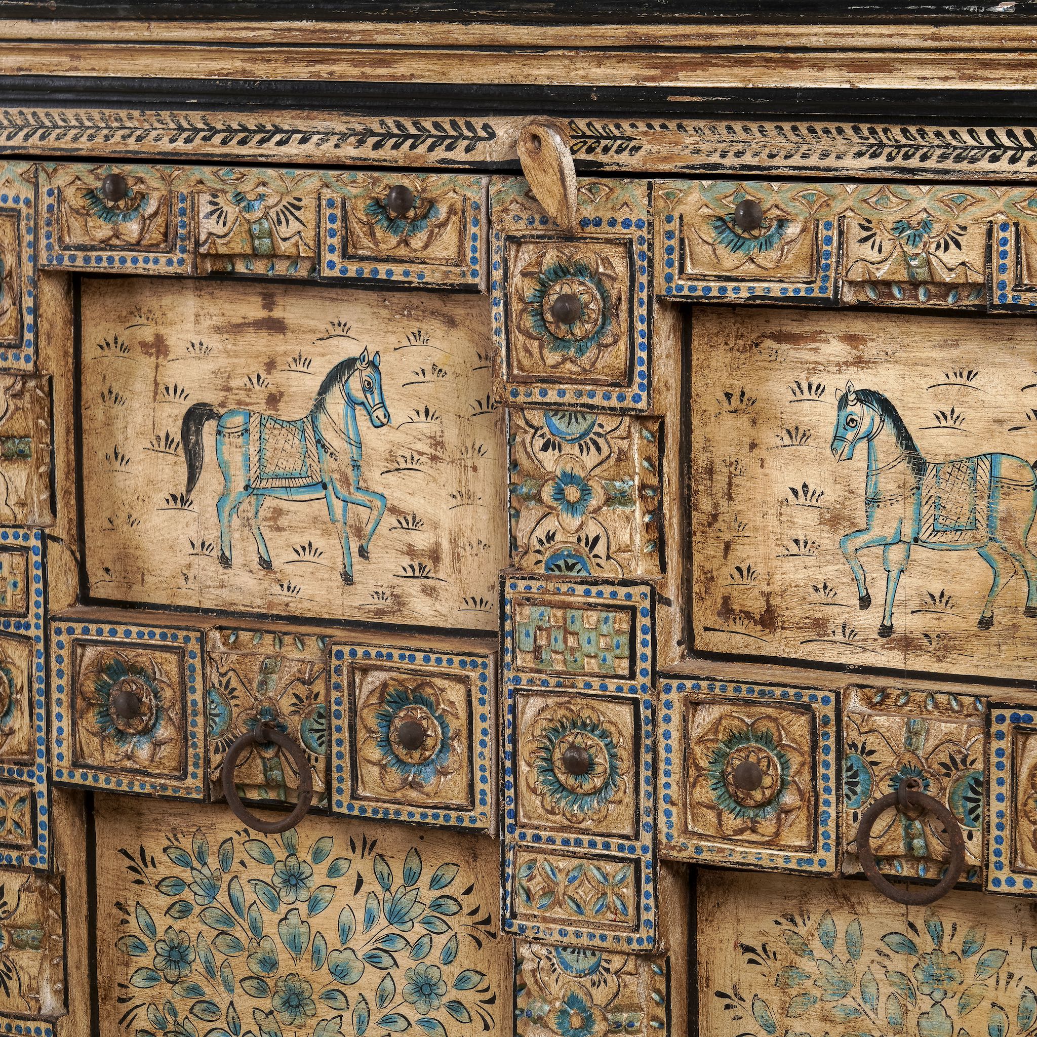 Close up image of a unique sideboard made of recycled wood with hand painted Indian motifs in blue and gold; sustainable furniture for dining rooms or hallways, 220 × 44 × 98 cm.