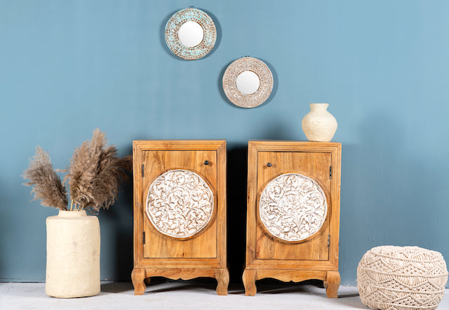 Whitewashed mango wood nightstand with hand-carved floral door – a handcrafted example of carved wooden furniture ideal for rustic and vintage bedrooms.