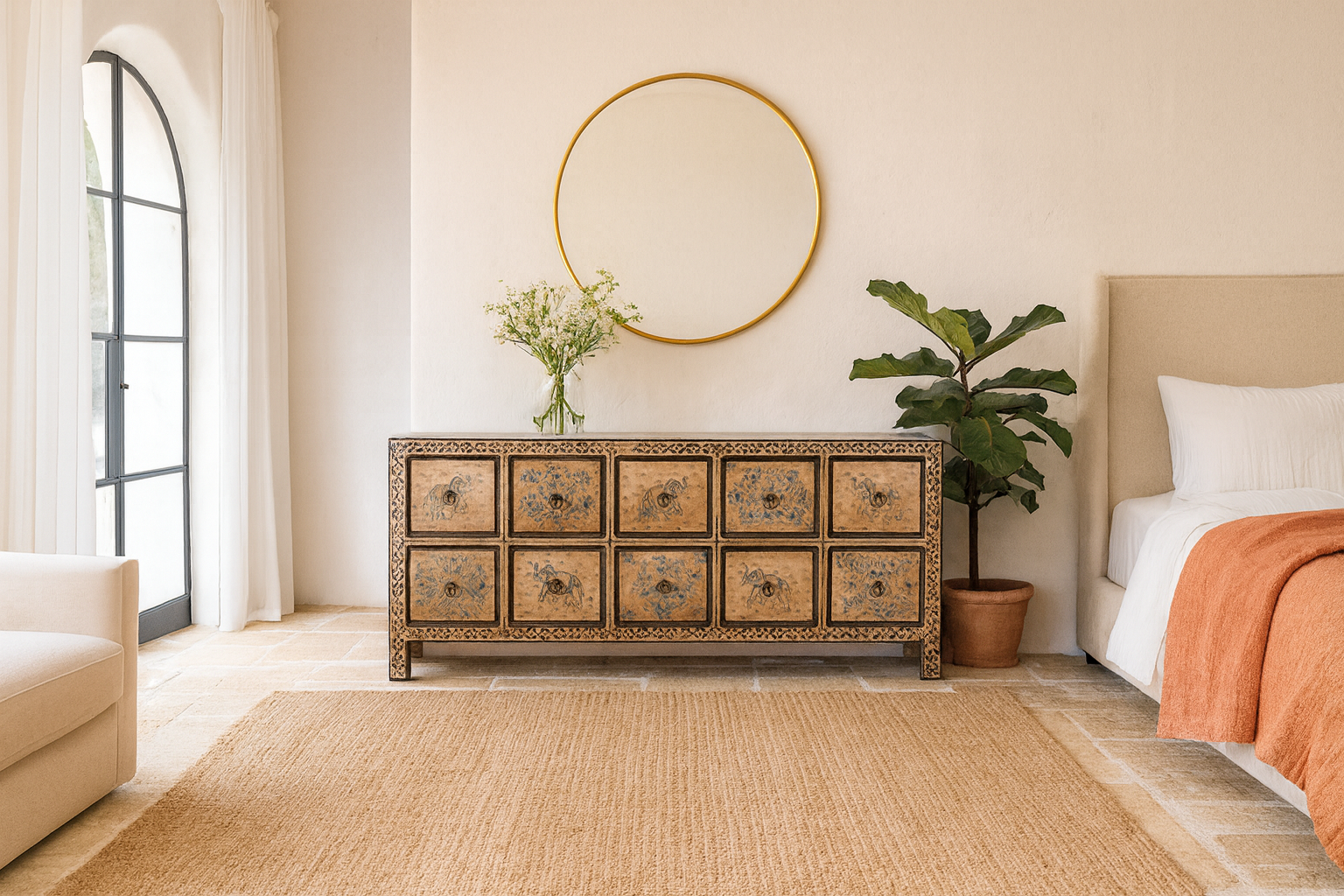 Life style imagination of a hand painted mango wood chest of 10 drawers with elephant and floral motifs; hand painted furniture for a boho chic living room, 200 × 41 × 85 cm.