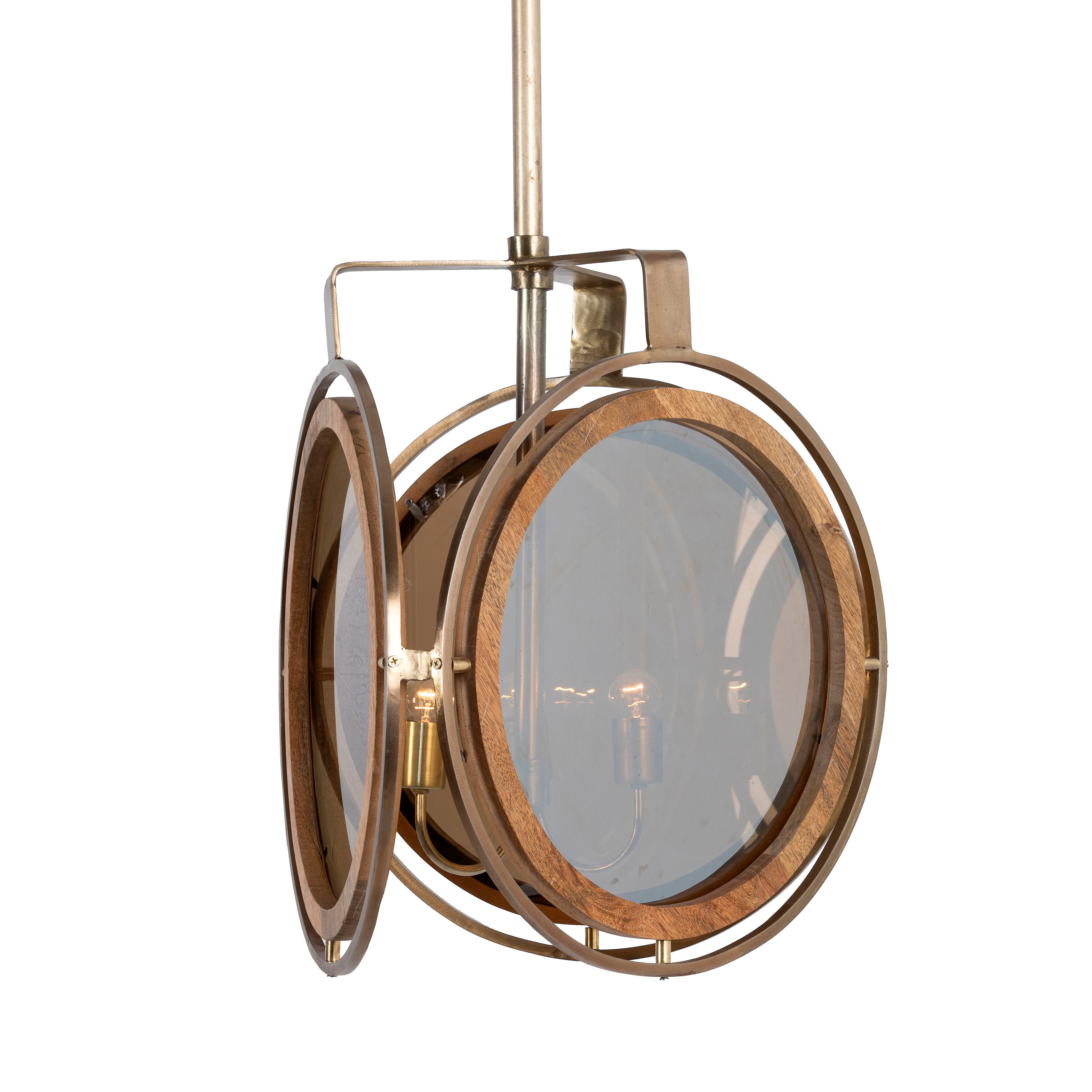 White background image of a artsy pendant lamp with 3-circle mango wood and brass-plated design, tinted glass inserts – vintage lighting piece for dining rooms, kitchens, or stylish living areas.