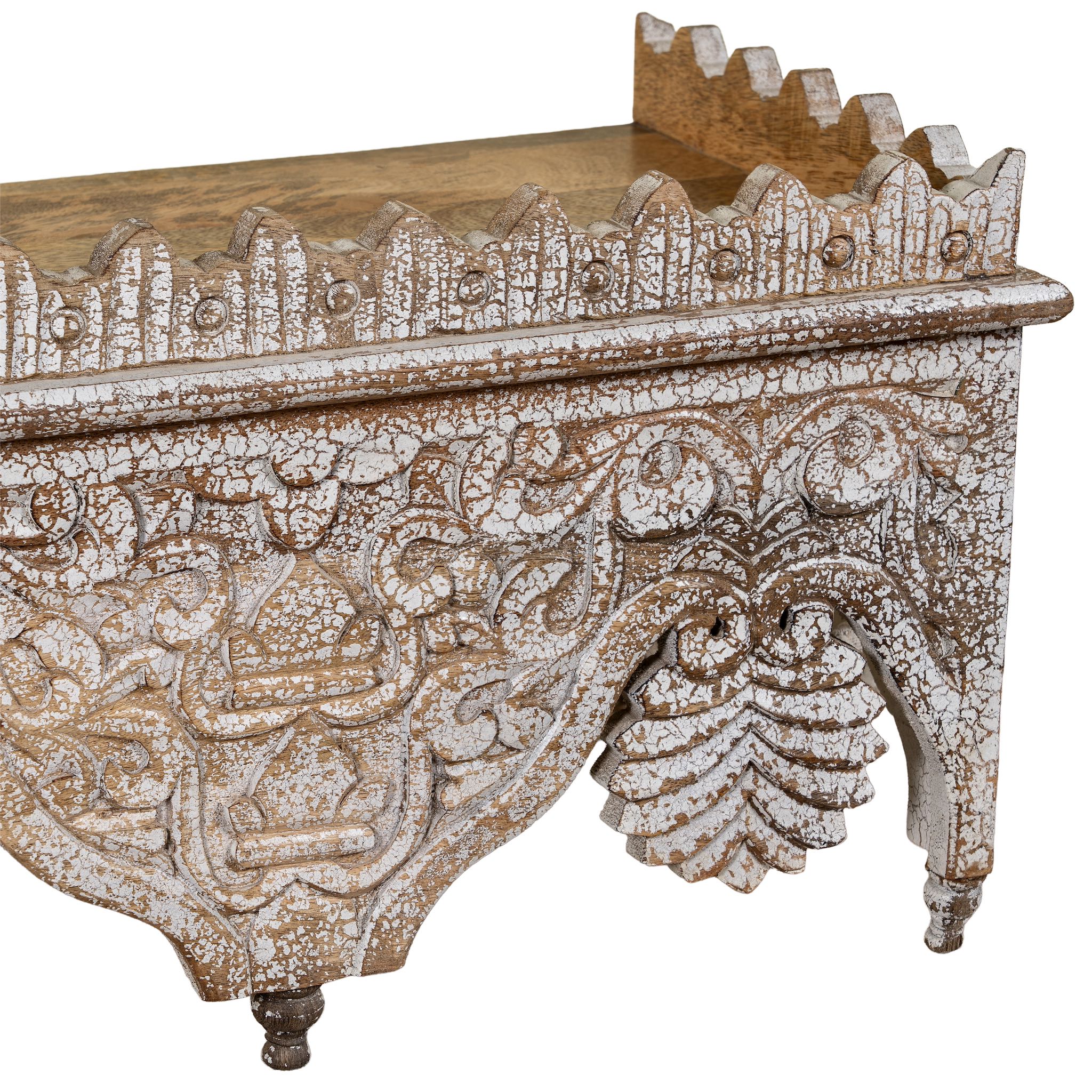 Close up image of a carved mango wood shelf in distressed vintage finish; artisanal furniture and vintage home decor, 90 × 25 × 30 cm.