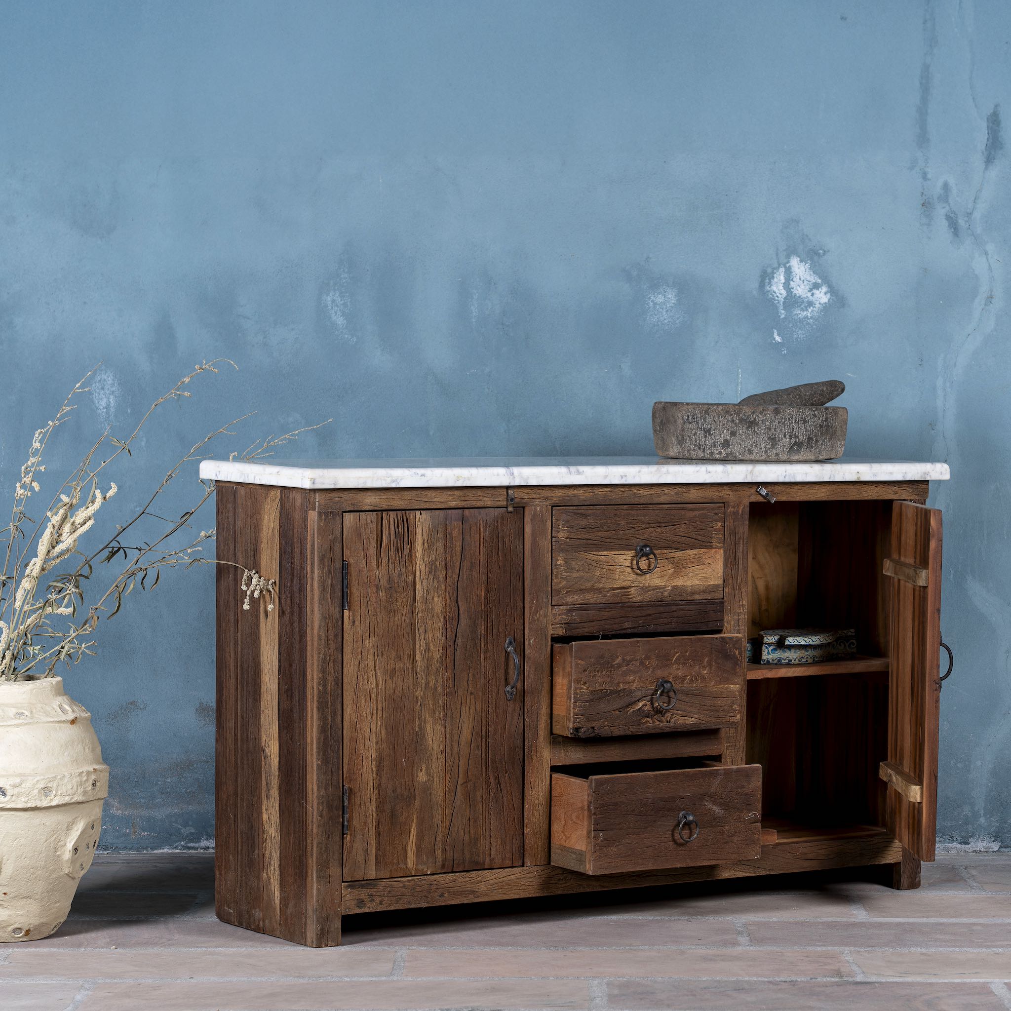 Open door image of a wabi sabi furniture driftwood sideboard with white marble top, minimalist Japandi cabinet with drawers and sliding surface, 125 × 35 × 75 cm.