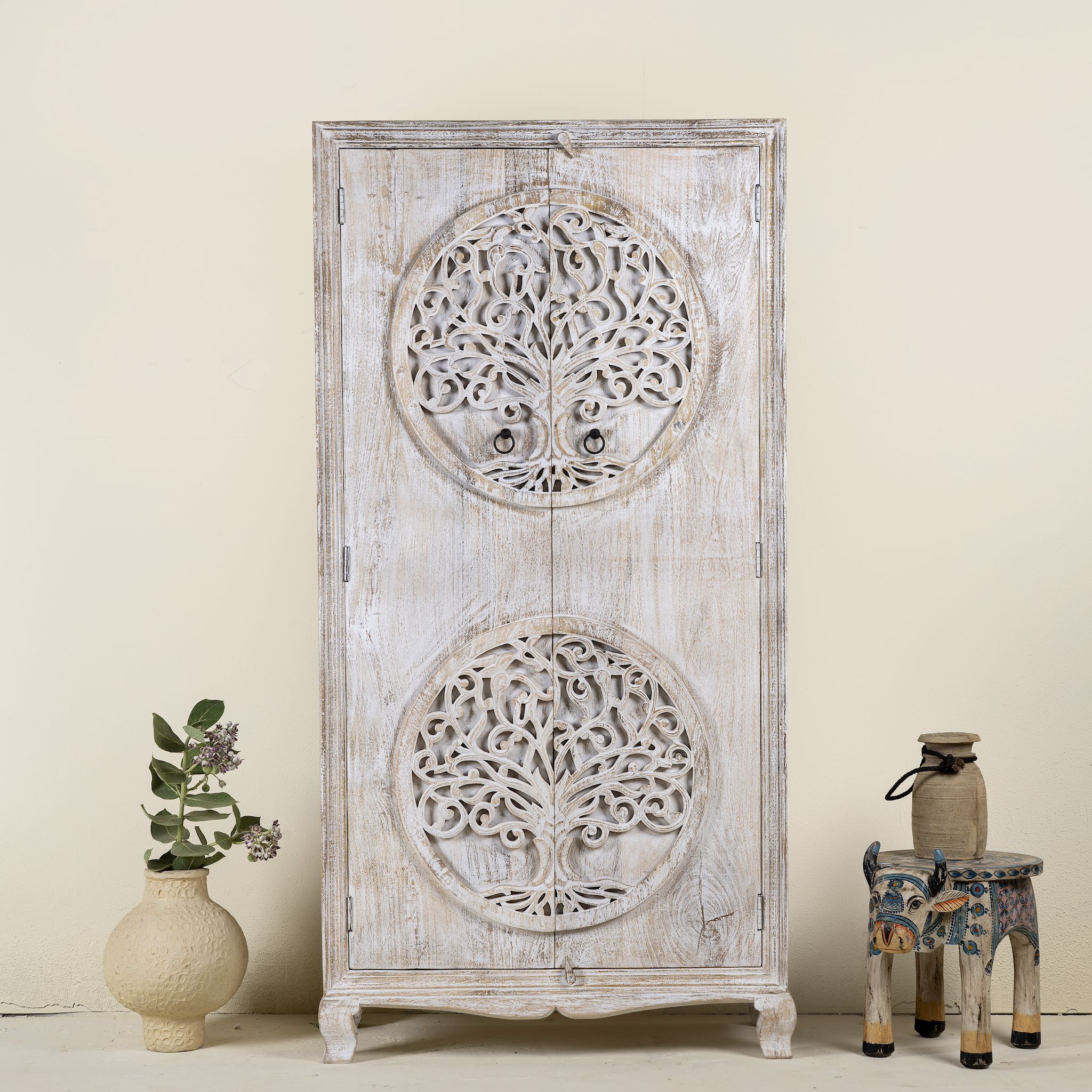 Hand-carved mango wood wardrobe with Tree of Life design, distressed finish, ideal for bohemian interiors, 90 × 40 × 180 cm.