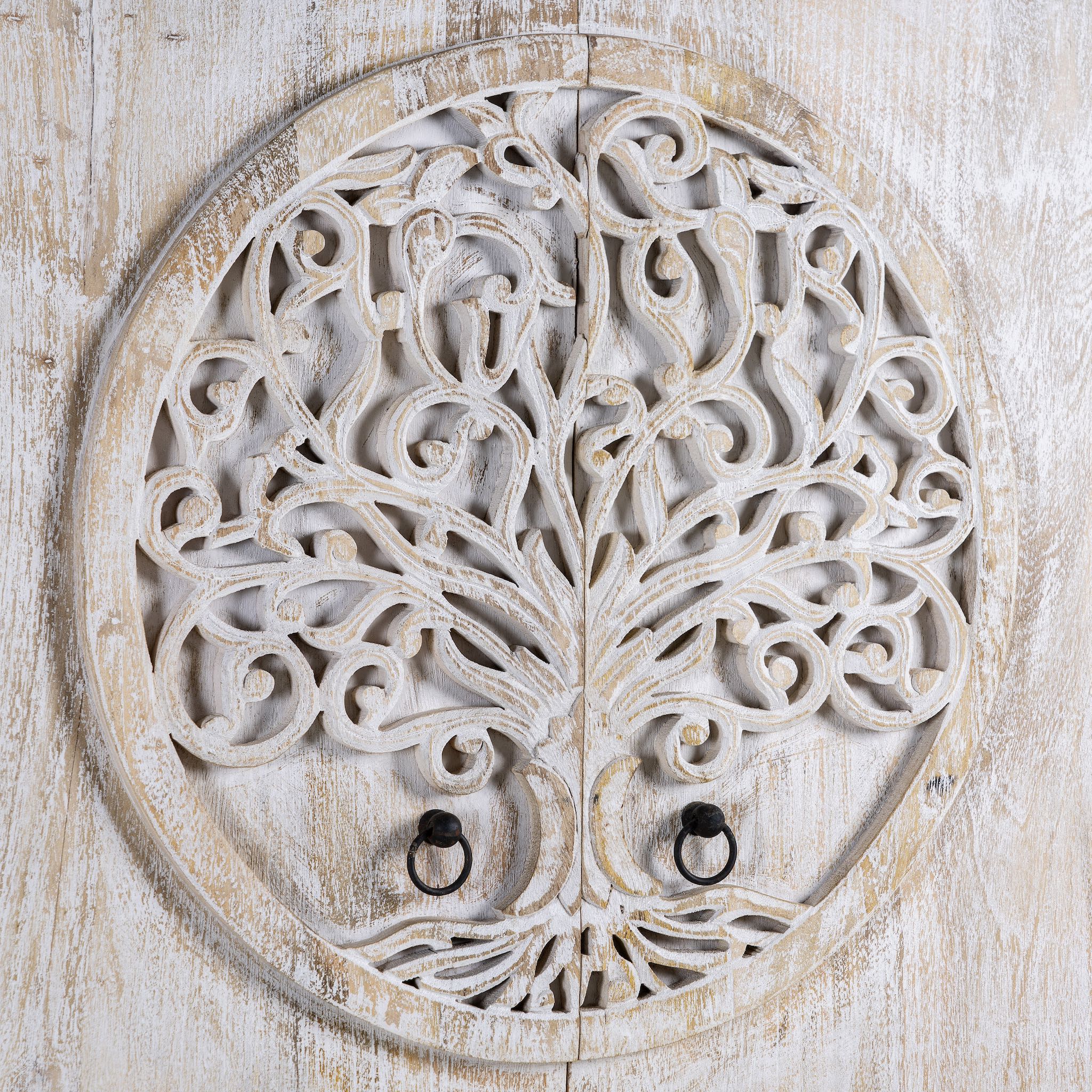 Close up image of a white washed armoire with hand-carved Tree of Life motif, mango wood carved wood furniture with storage, 90 × 40 × 180 cm.