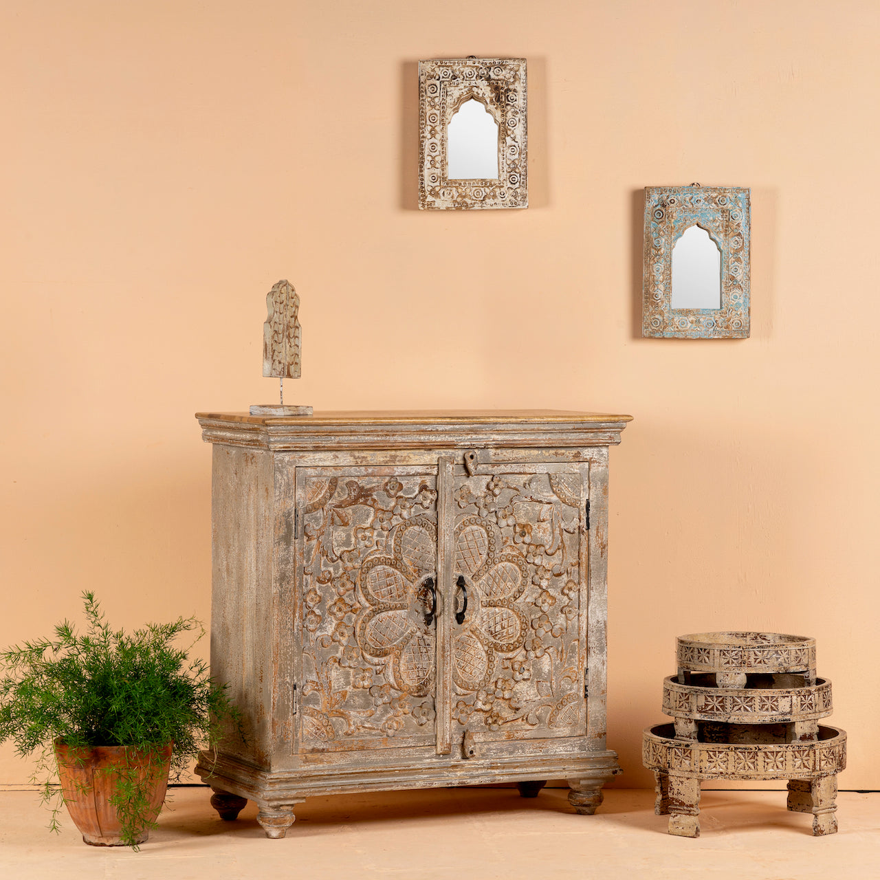 Side angle image of a square carved wood sideboard with whitewashed floral detailing; ideal as living room furniture, 90 × 90 × 40 cm.