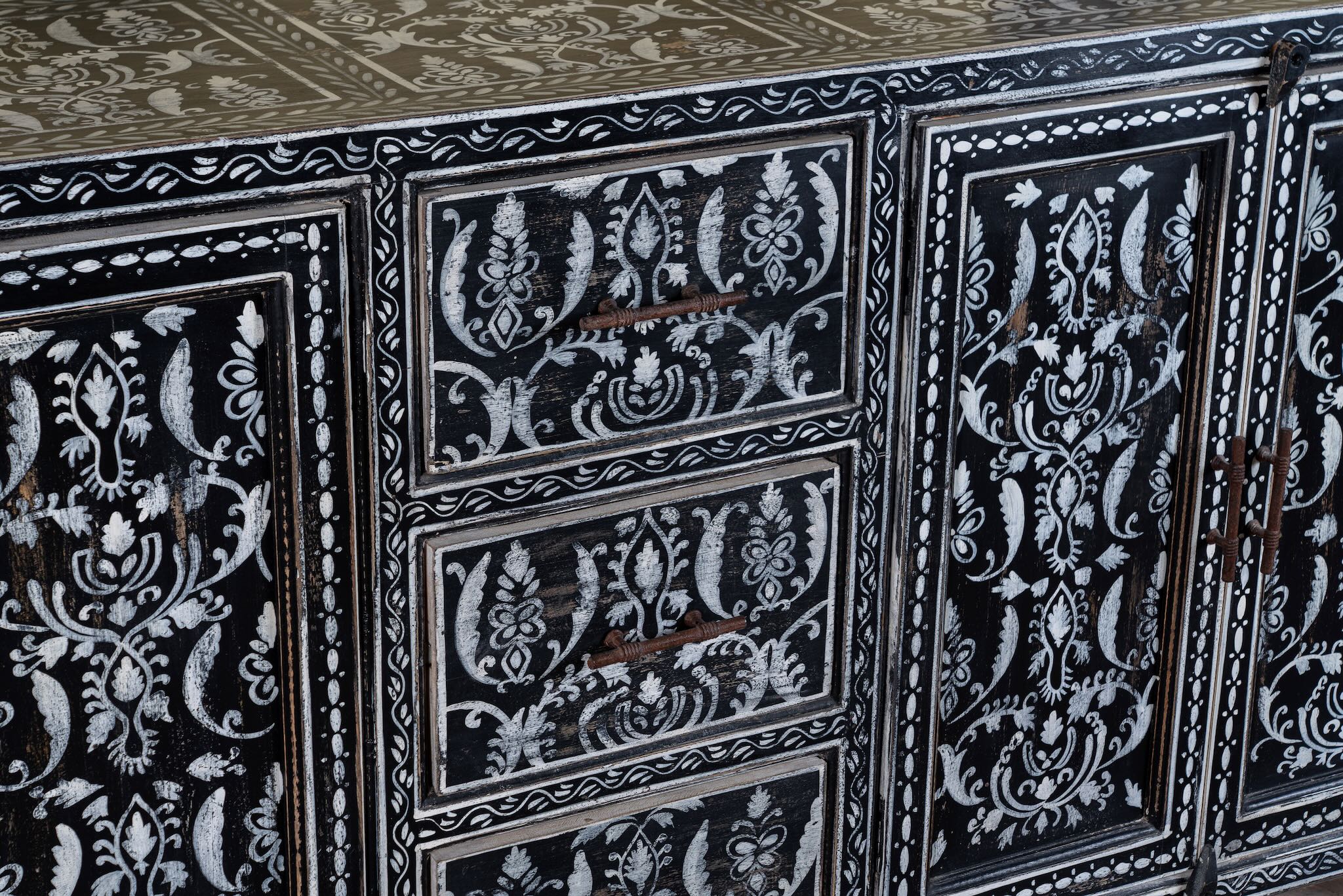 Close up image of a hand-painted black and white sideboard made of reclaimed wood – Kaira model by Om Home & Garden