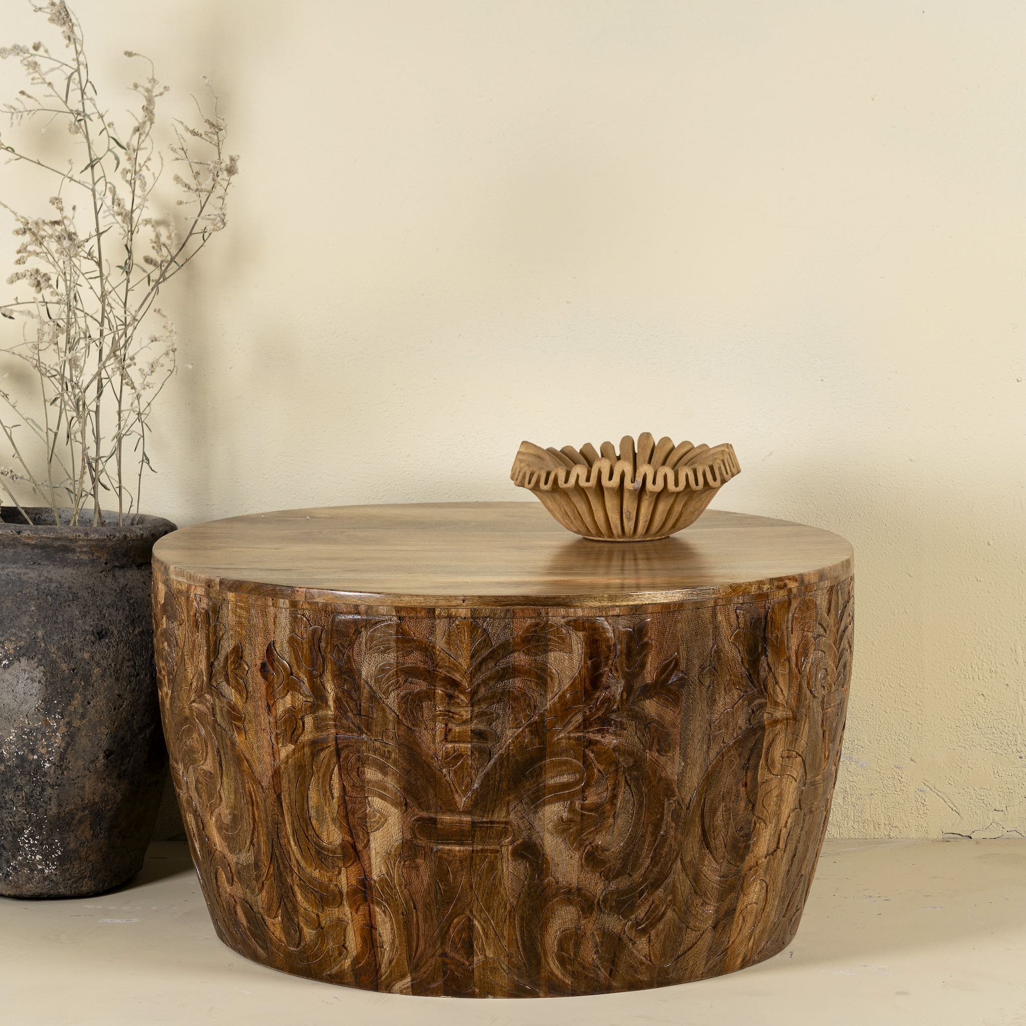 Round mango wood coffee table with hand-carved detailing and natural finish; rustic carved coffee table, 90 cm diameter, 52 cm height.