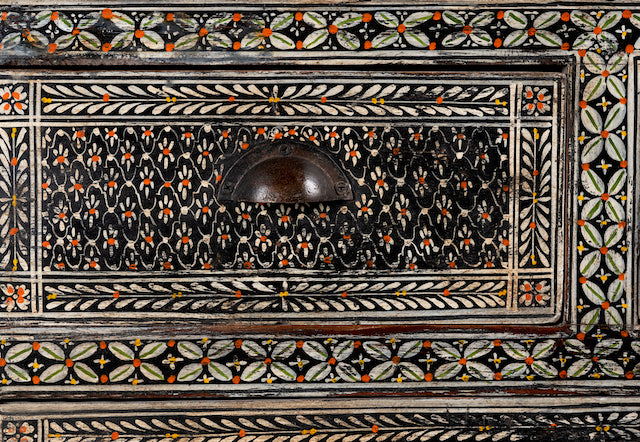 Close up image of a hand-painted Indian chest of drawers made from recycled wood – unique furniture featuring colourful motifs and antique craftsmanship.