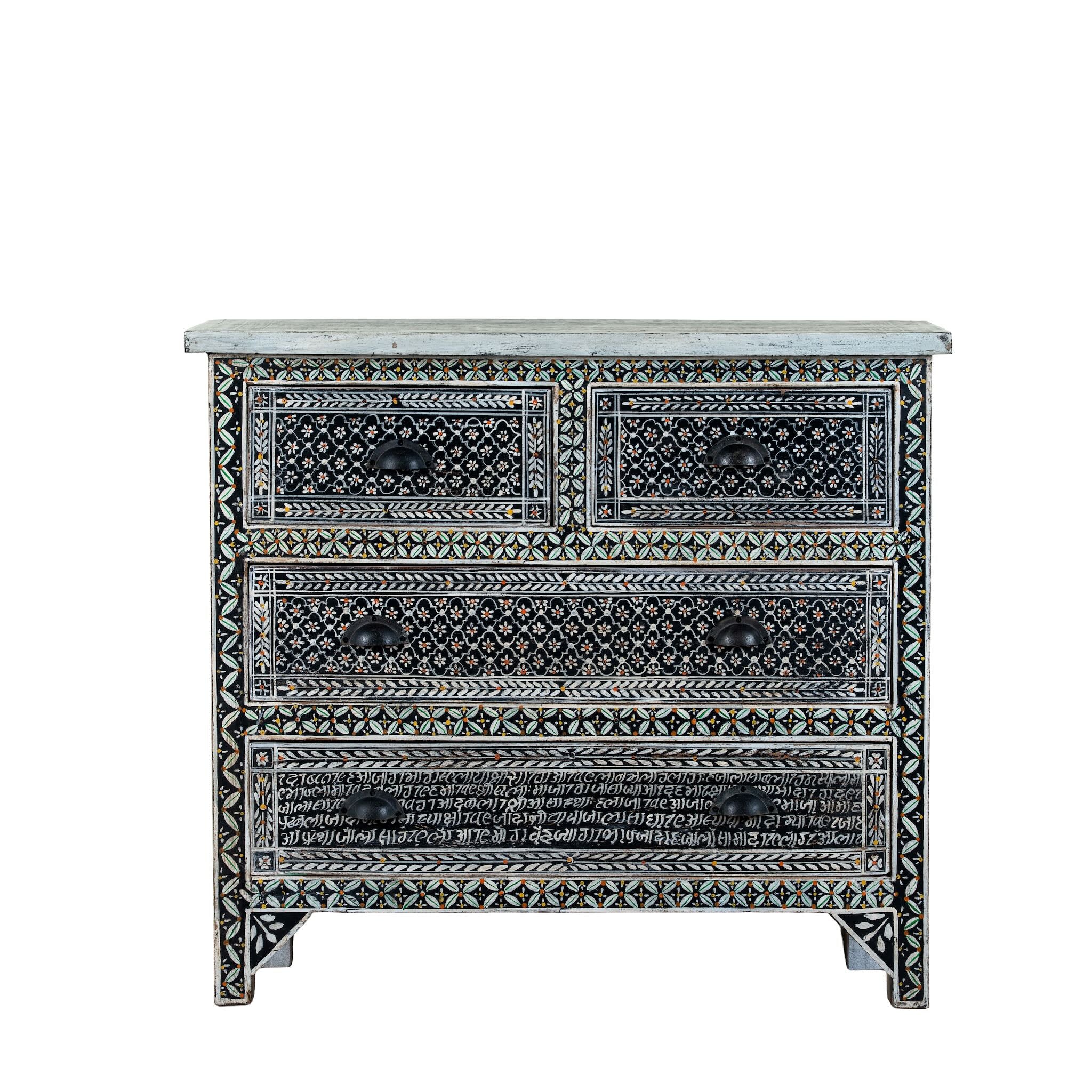 White background image of a of a hand-painted Indian chest of drawers made from recycled wood – unique furniture featuring colourful motifs and antique craftsmanship.