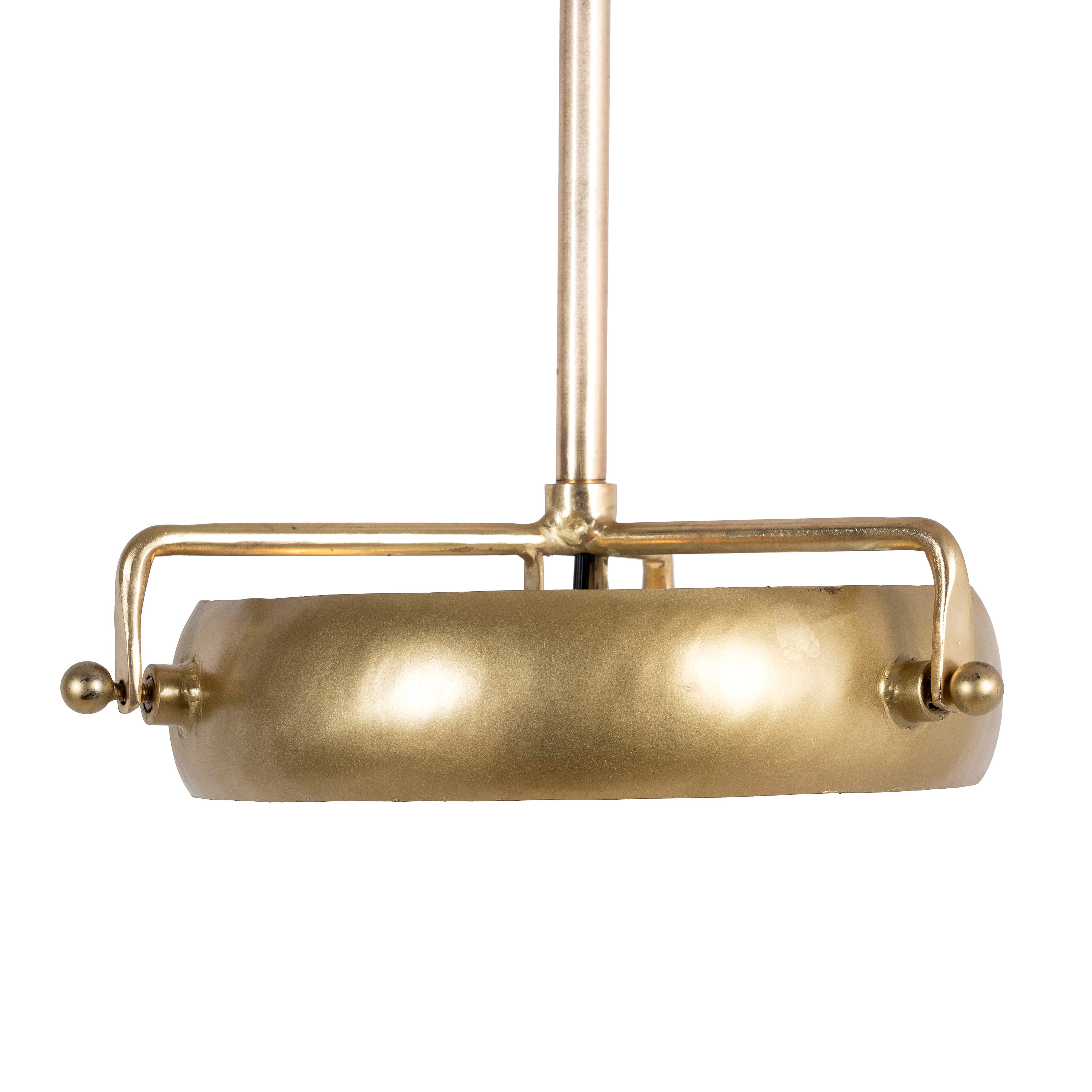 White background image of a round artsy pendant lamp with clear hand-blown glass and brass-plated iron frame – retro lighting piece ideal for kitchens, dining rooms, or living areas.