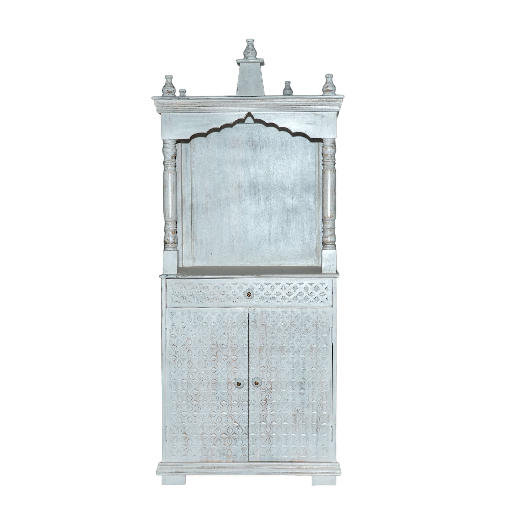 White background image of a Shivani mango wood house temple in whitewashed finish with carved floral doors and traditional arched canopy—an elegant example of hand-carved Mandirs and Indian home temples.