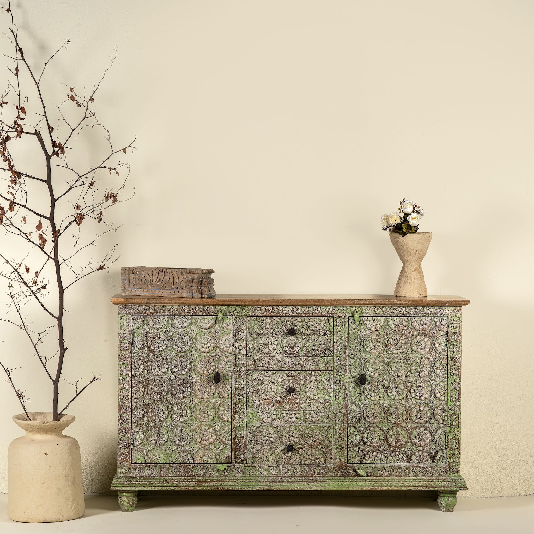 Carved wooden furniture sideboard with floral hand-carving and distressed finish, vintage style cabinet made from mango wood, 150 × 40 × 90 cm.