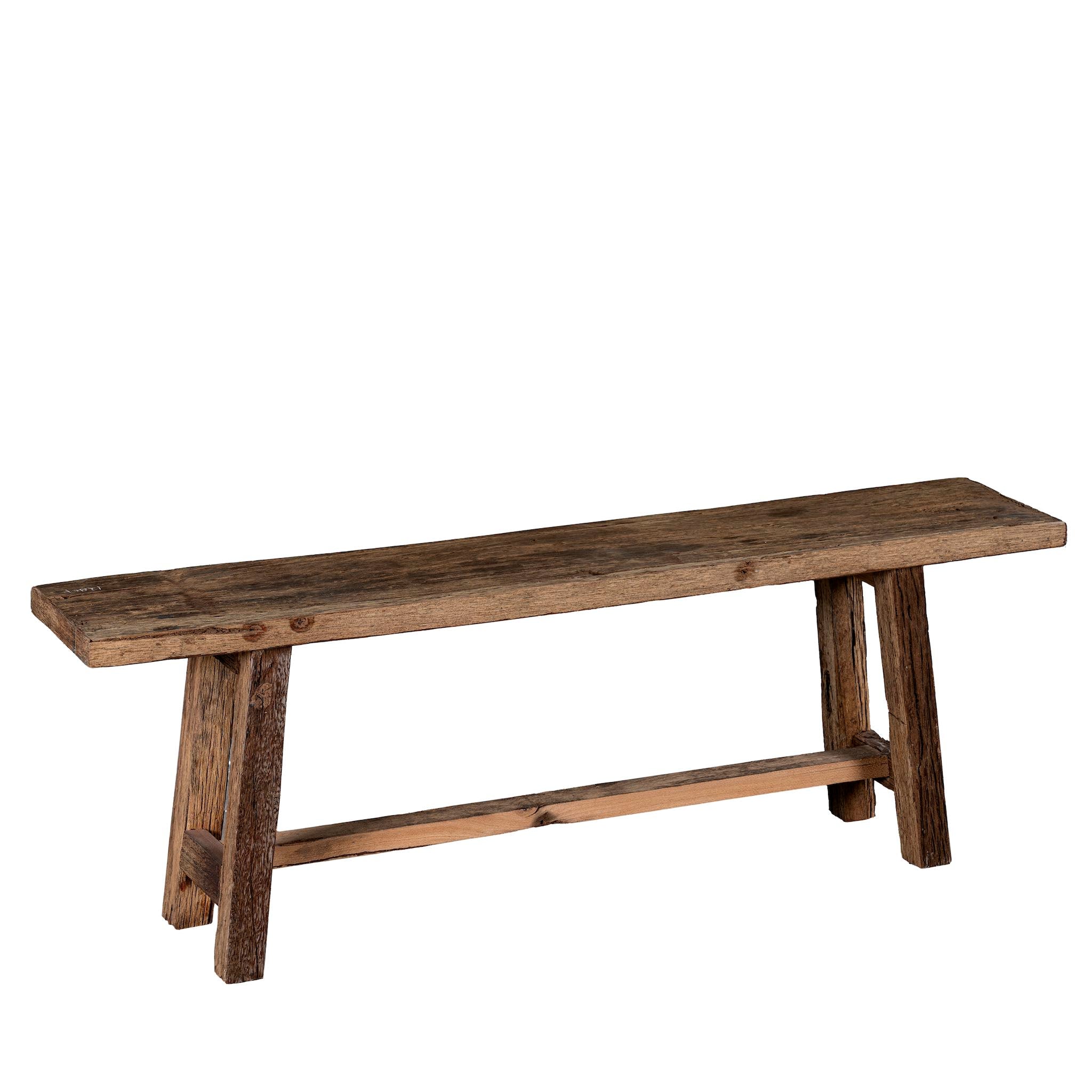 White background image of a rustic driftwood bench made from reclaimed wood with aged finish and angled legs; handcrafted rustic wood furniture, 130 × 25 × 45 cm.