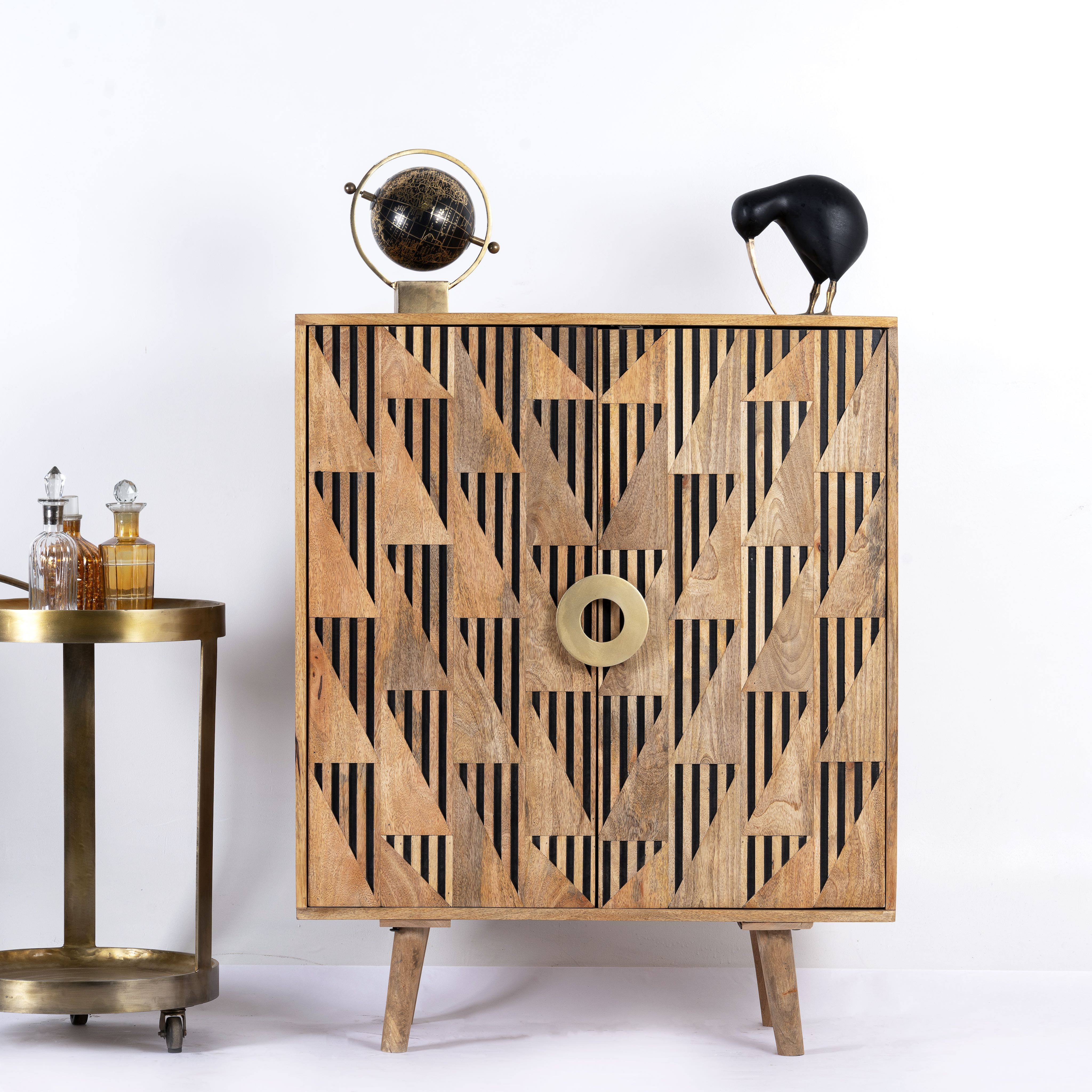 Artisanal mango wood cabinet with natural doors, black frame, and brass knobs, 91 × 113 × 41 cm.