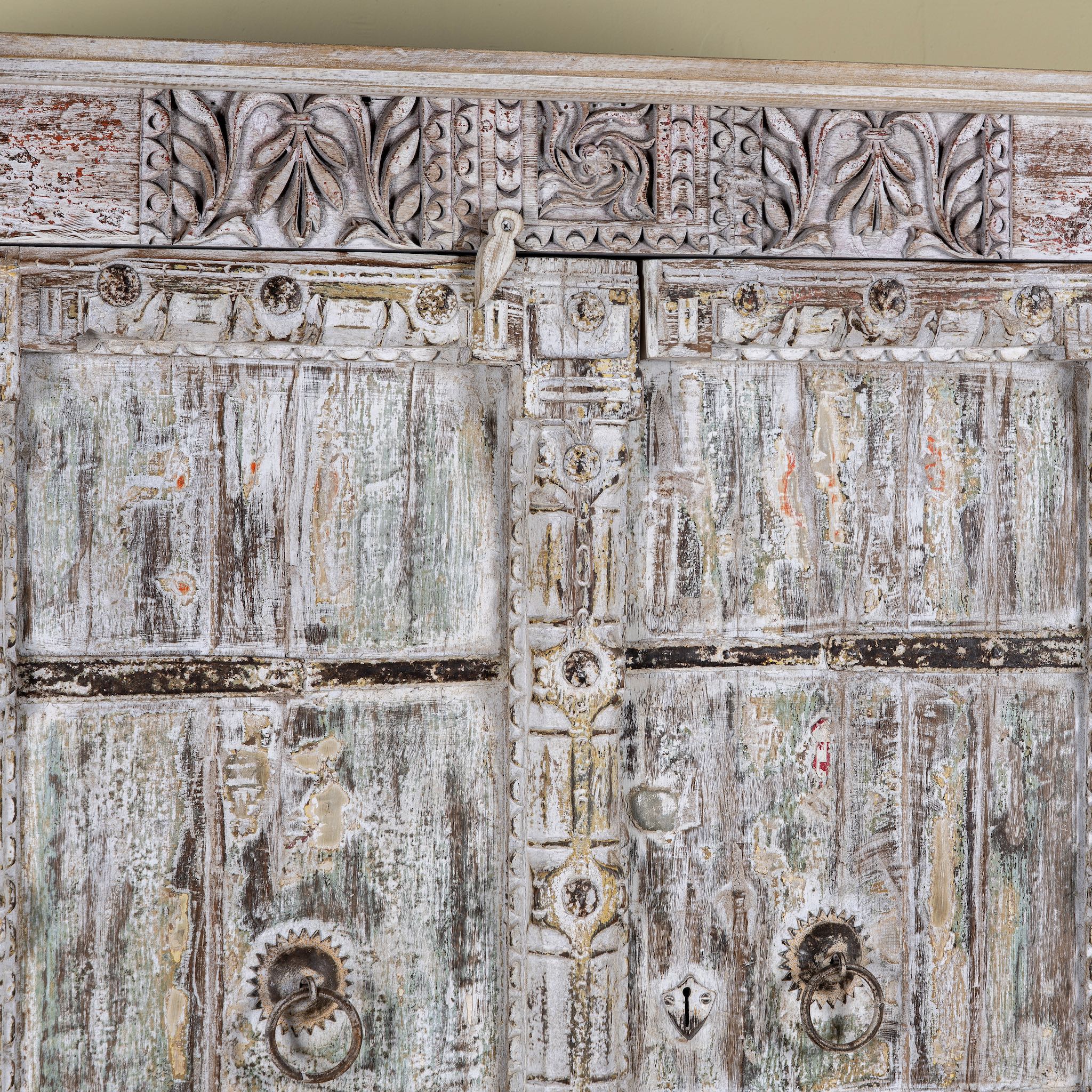 Close up image of a reclaimed wood wardrobe made with antique door panels – a handcrafted piece of old door furniture perfect for Indian home decor and rustic interiors.