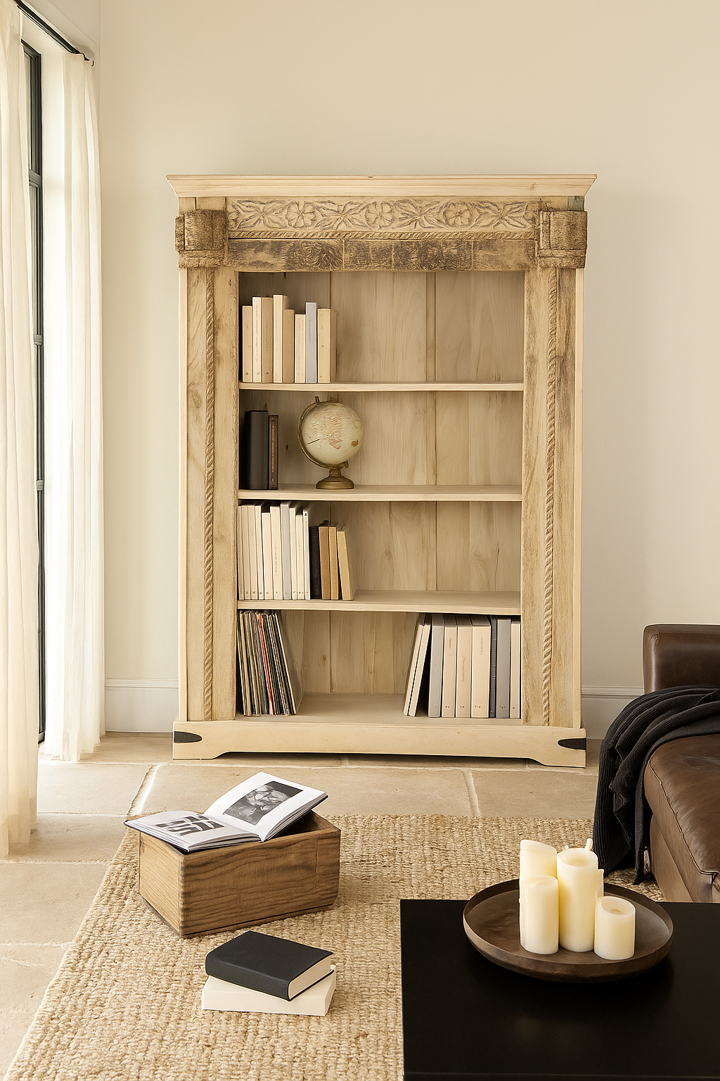 Lifestyle image of a hand-carved shelf made from reclaimed teak wood and mango wood, unique furniture with Ibiza-inspired finish, 150 × 208 × 52 cm.