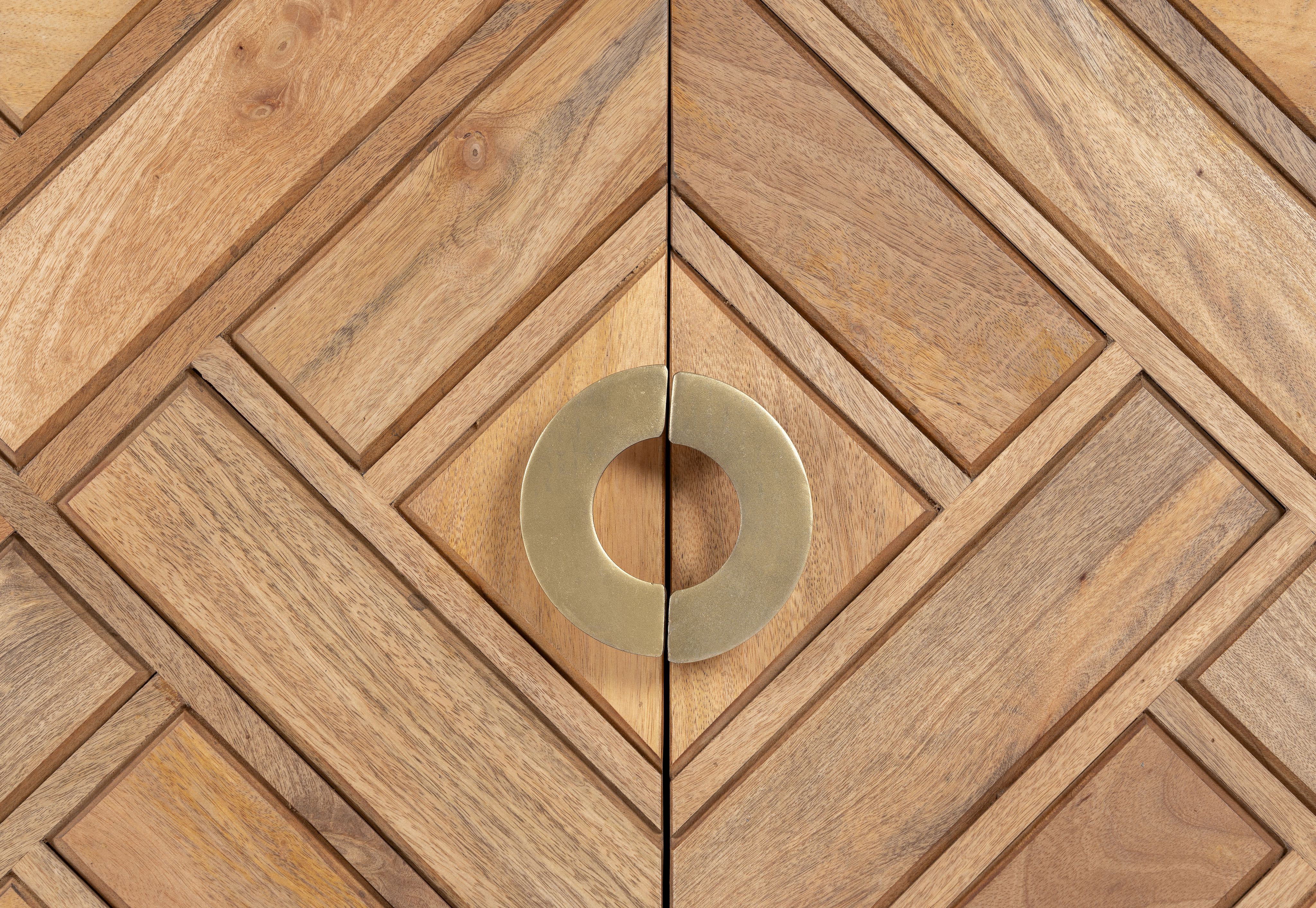 Close up image of a handcrafted mango wood sideboard with tiled front design, brass stand, and handles—minimalistic style furniture blending natural warmth with refined elegance.