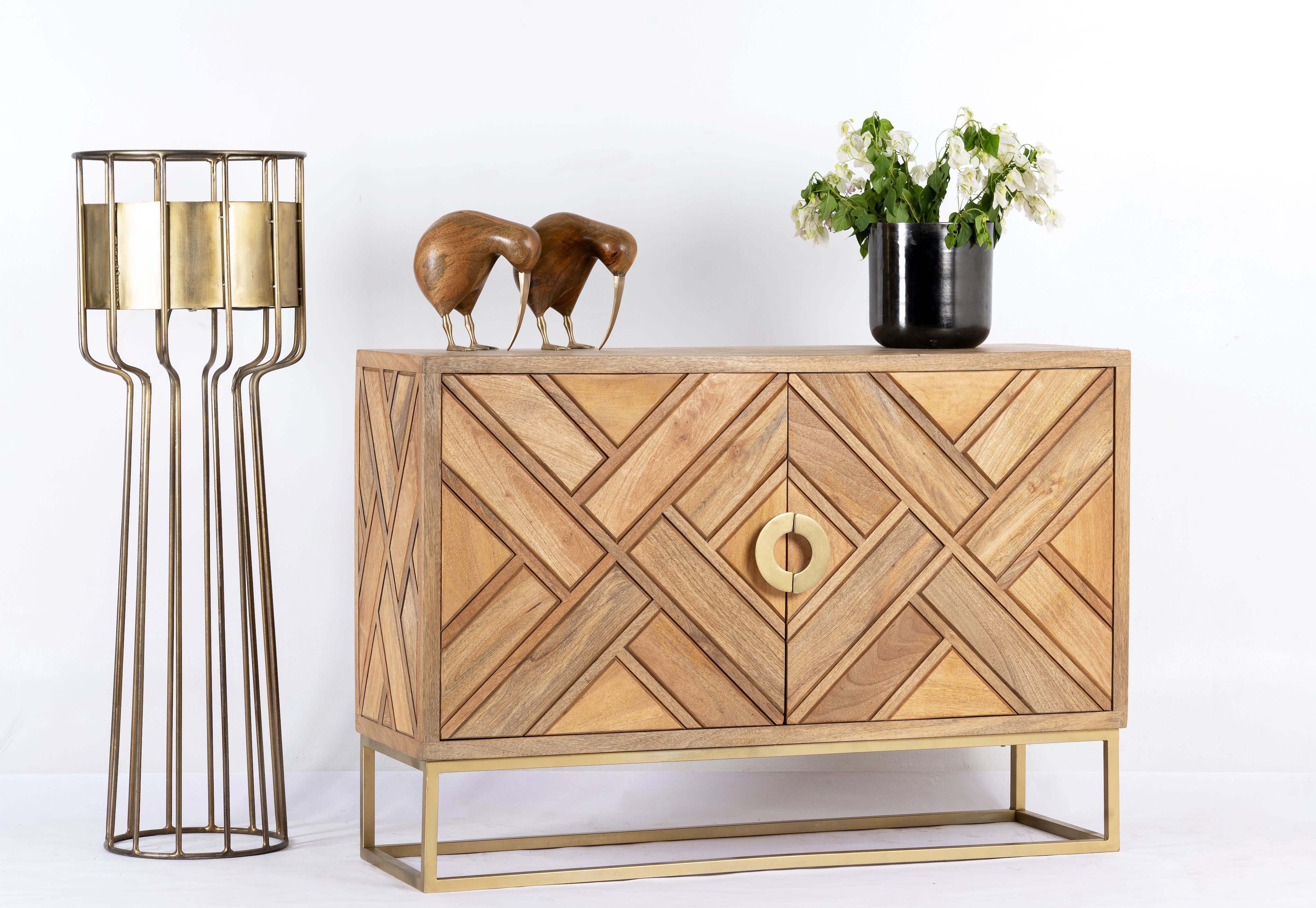 Side angle image of a handcrafted mango wood sideboard with tiled front design, brass stand, and handles—minimalistic style furniture blending natural warmth with refined elegance.