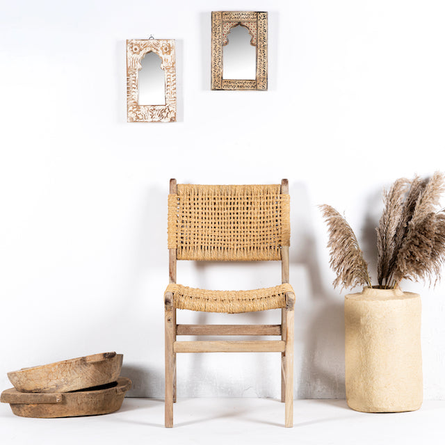 Image of a decorated handcrafted Ibiza style wooden chair made from recycled teak with upholstered seat and natural weed canopy, 45 × 50 × 47 cm, backrest height 85 cm.
