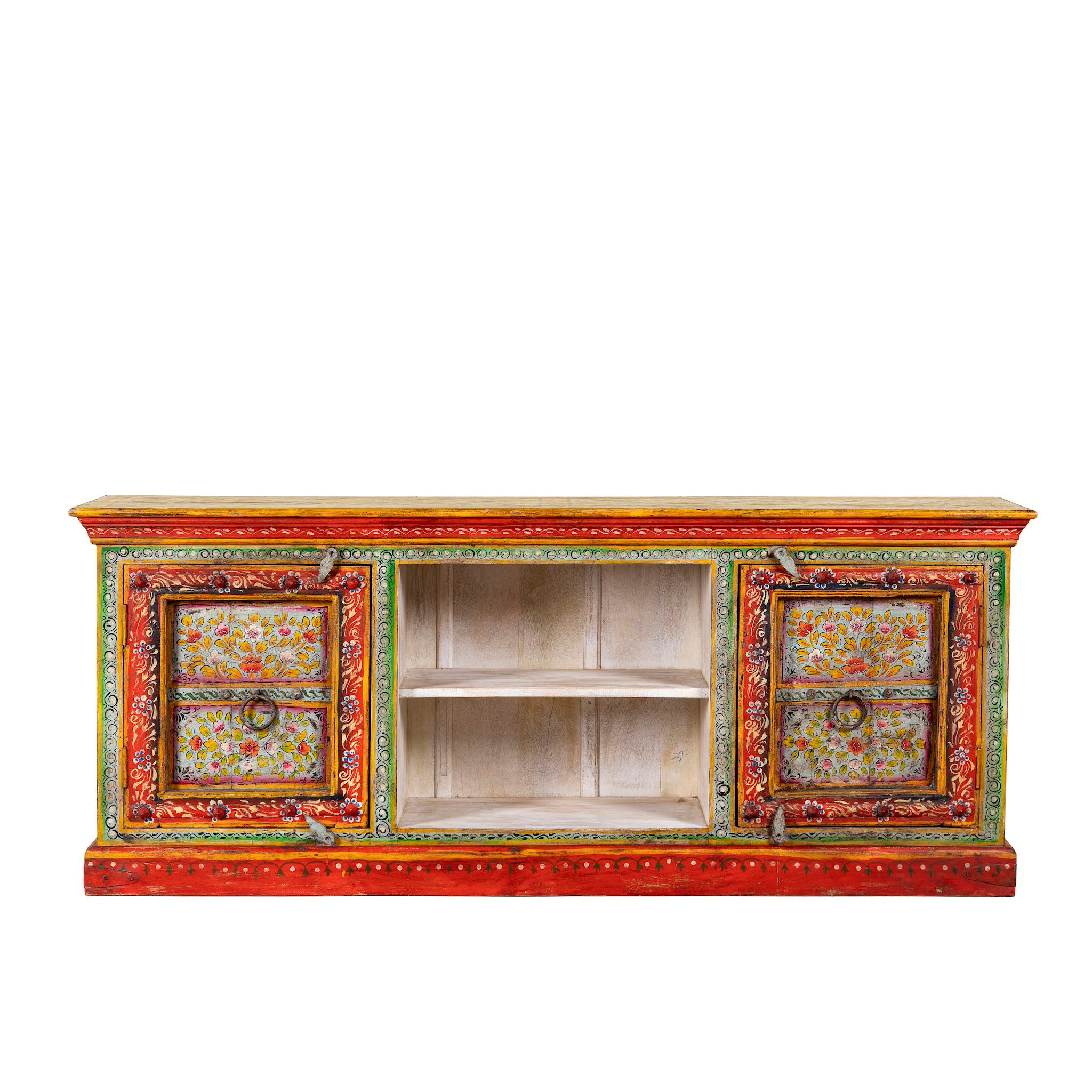 White background image of a hand-painted reclaimed wood vintage lowboard with floral motifs – a colourful piece of sustainable furniture for artistic and rustic interiors.