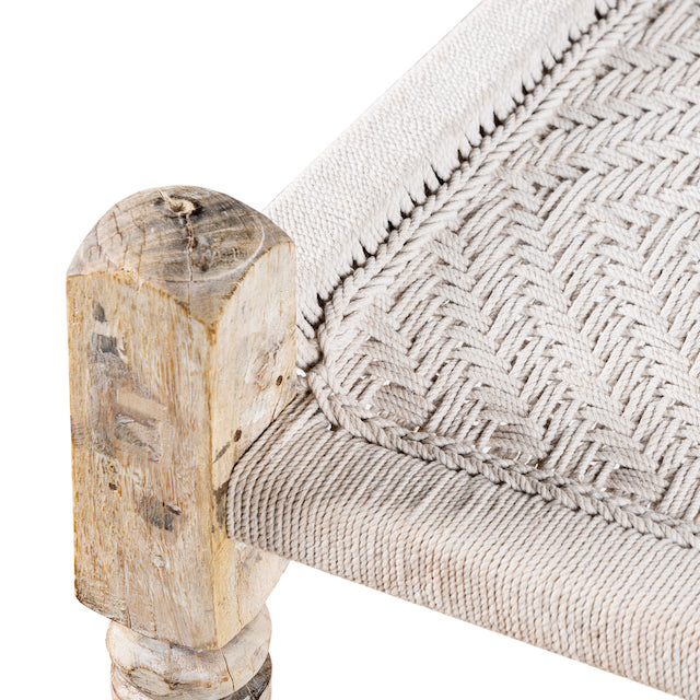 Close up image of a traditional Indian day bed made from reclaimed teak with handwoven cotton rope; unique Indian furniture, 160 × 93 × 62 cm.