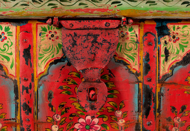 Close up image of a unique Indian furniture box hand-painted on solid recycled teak – vibrant painted teak furniture ideal for living rooms or eclectic interiors.