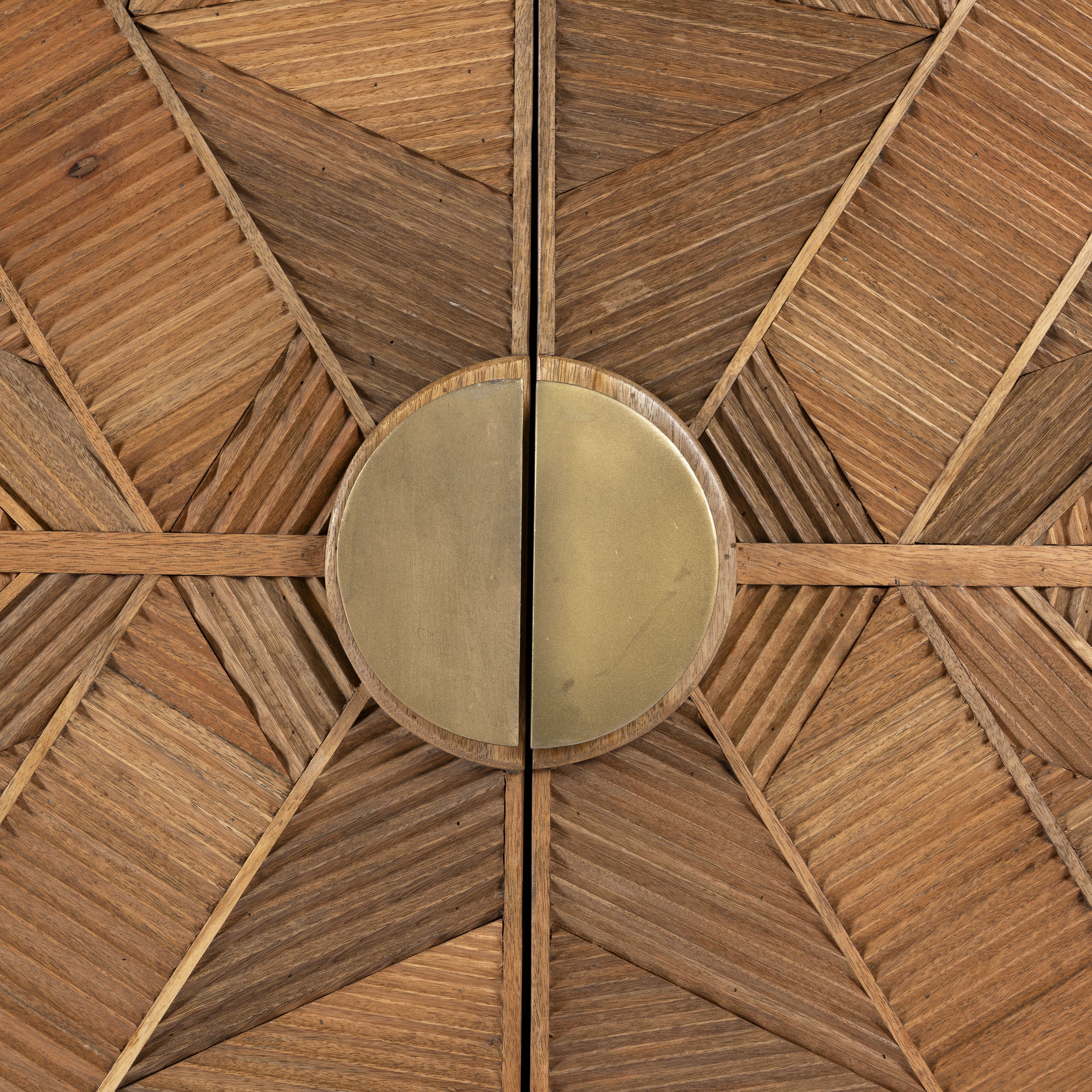 Close up image of a natural mango wood cupboard with carved linear design and antique brass legs, 91 × 40 × 109 cm.