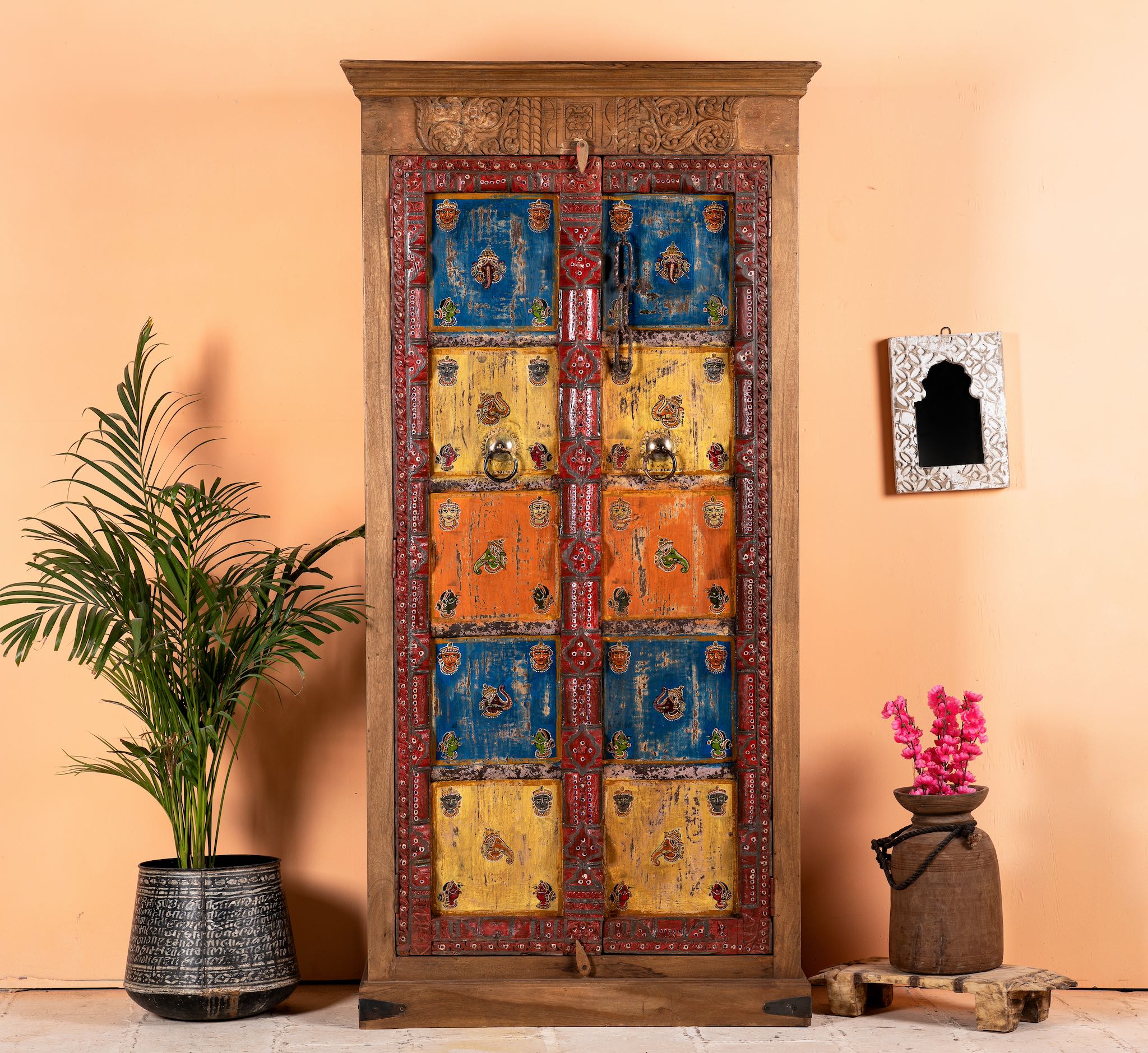 Hand-painted cabinet made from reclaimed teak wood with colourful Indian motifs – sustainable furniture and vintage teak wood craftsmanship for bold interiors.