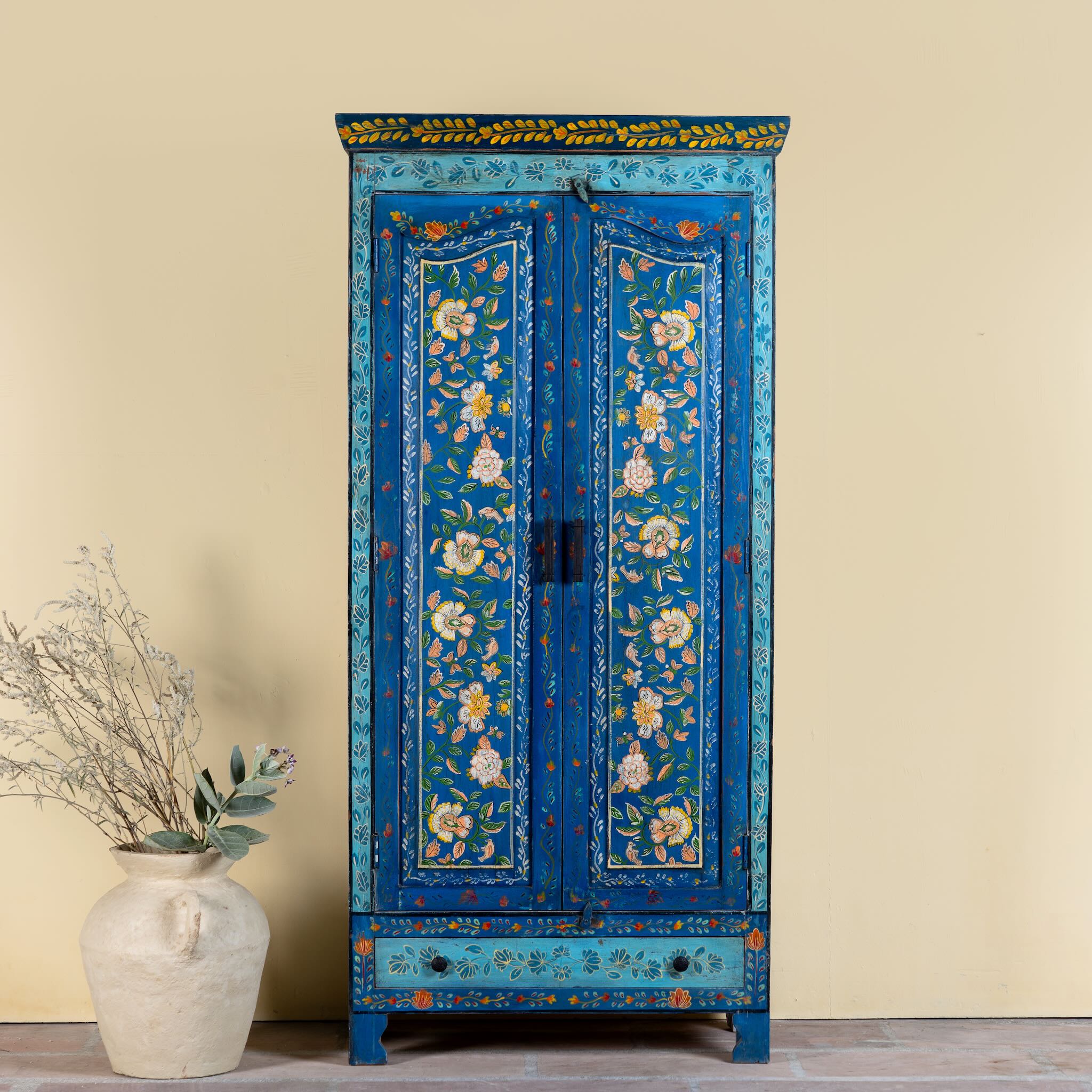 Hand-painted wardrobe made of reclaimed wood in vibrant blue floral design – Yuvika model by Om Home & Garden