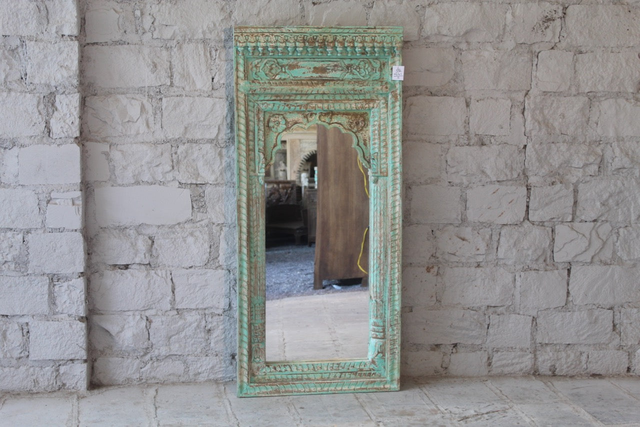 Warehouse image of a Hand carved wooden mirror made from antique Indian window frame, vintage green finish; 145 × 70 × 10 cm.