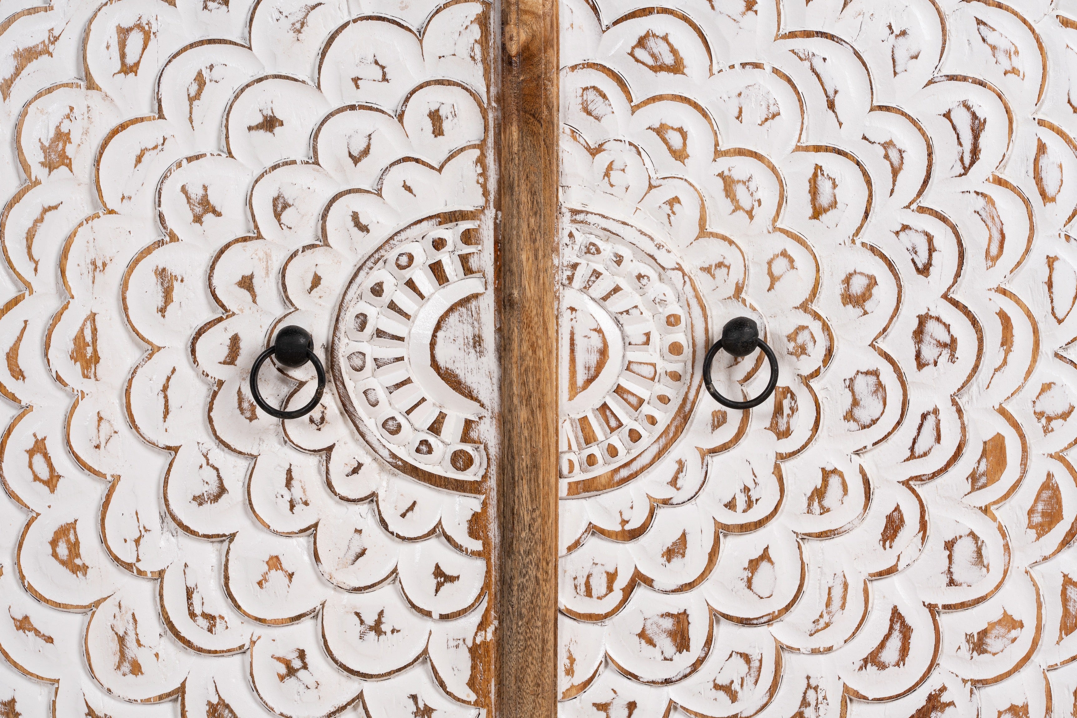 Close up image of a carved wood furniture cupboard with white-washed engraved doors and mango wood body, 90 × 90 × 40 cm.