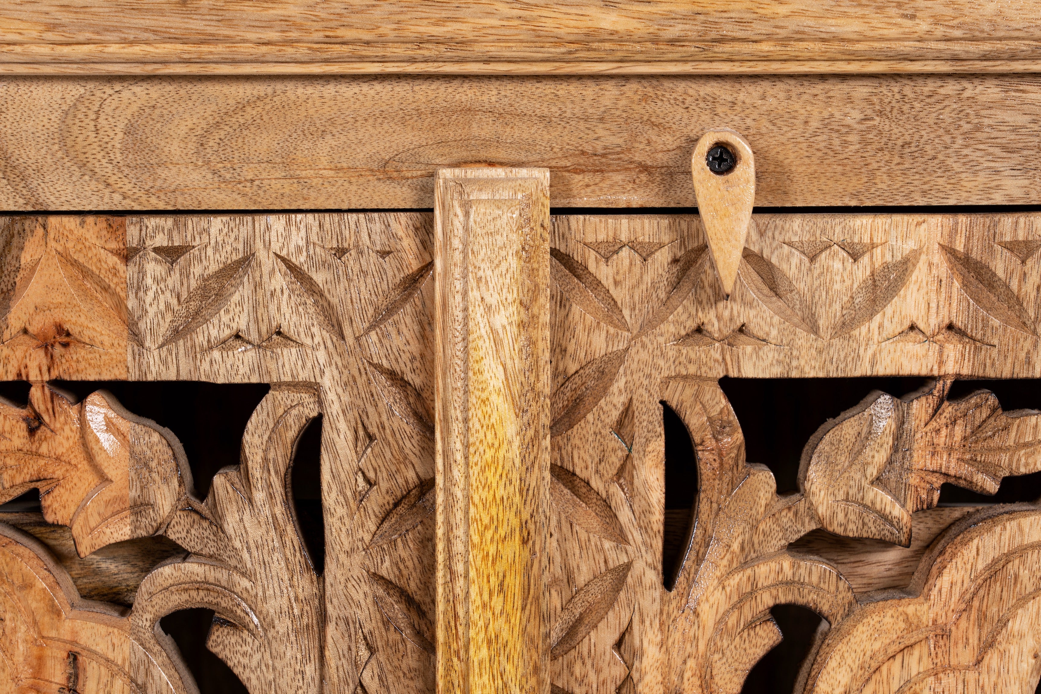 Close up image of a hand carved mango wood sideboard Bagodara with whitewashed finish and intricate Indian patterns; ideal for bedroom furniture or as a hand carved sideboard, 180 × 90 × 40 cm.