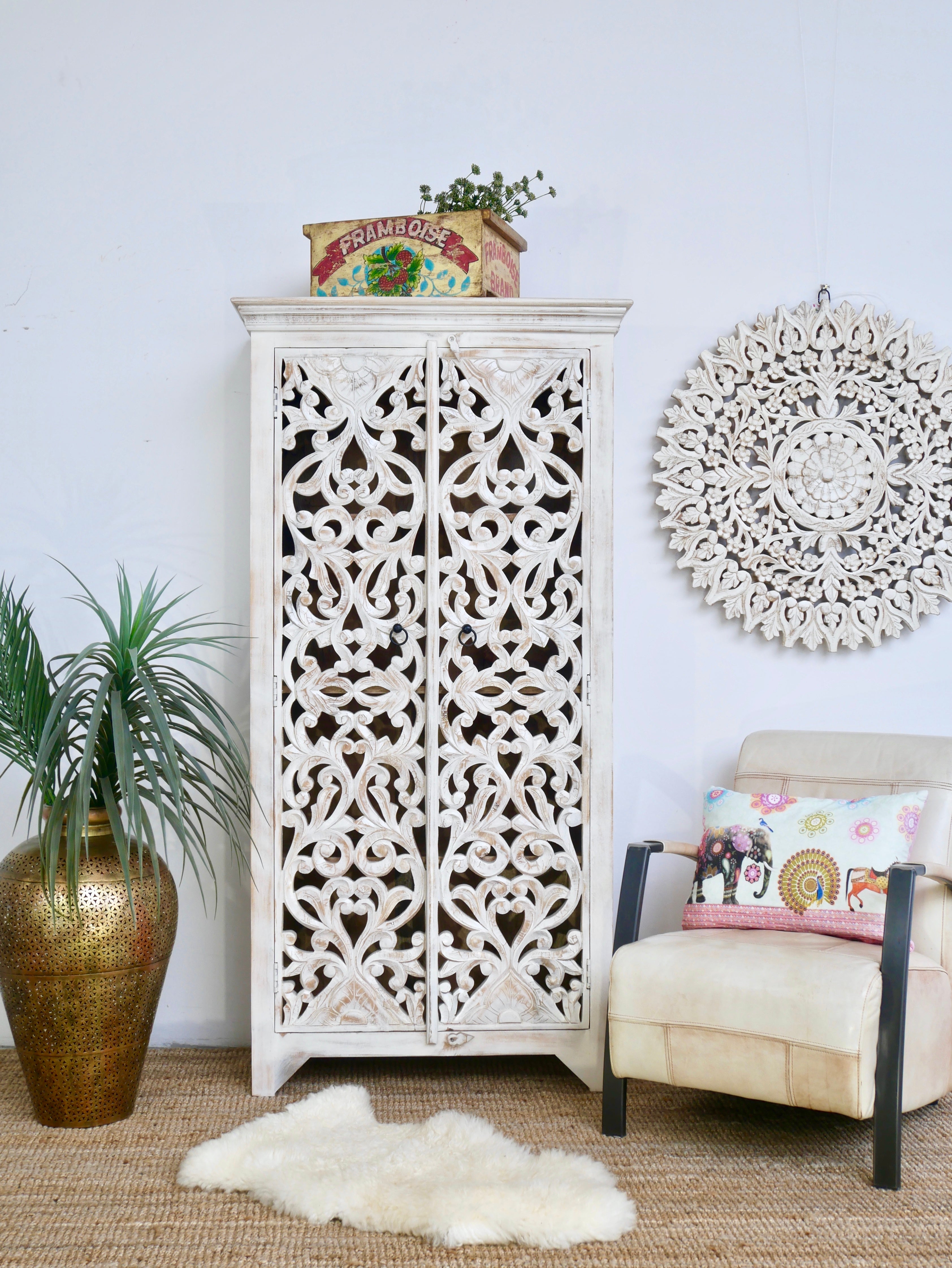 Hand-carved mango wood cabinet with floral and geometric motifs in white-washed finish – carved wooden furniture with Mediterranean-inspired design.