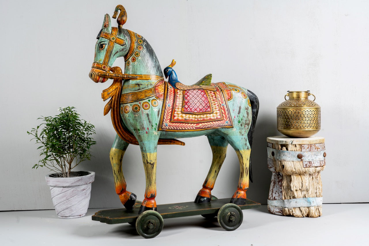 Large hand-painted Indian wooden horse sculpture on wheels – Rajasthani mango wood decor piece, ideal as artistic Indian home accessory, 110x90x30cm.