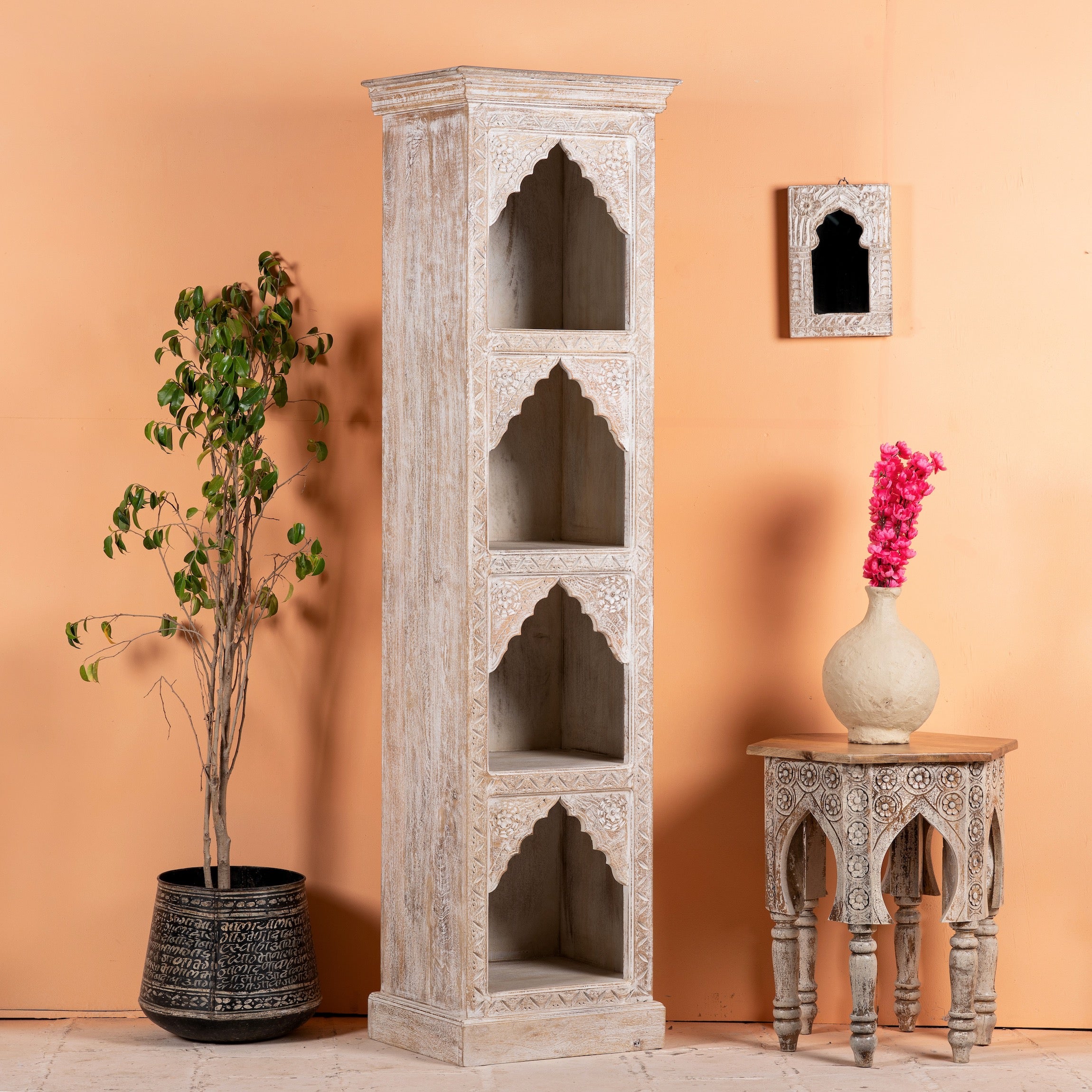 Side angle image of a hand-carved mango wood bookshelf with oriental detailing and natural wood finish – carved wooden furniture and vertical shelving for refined, rustic interiors.