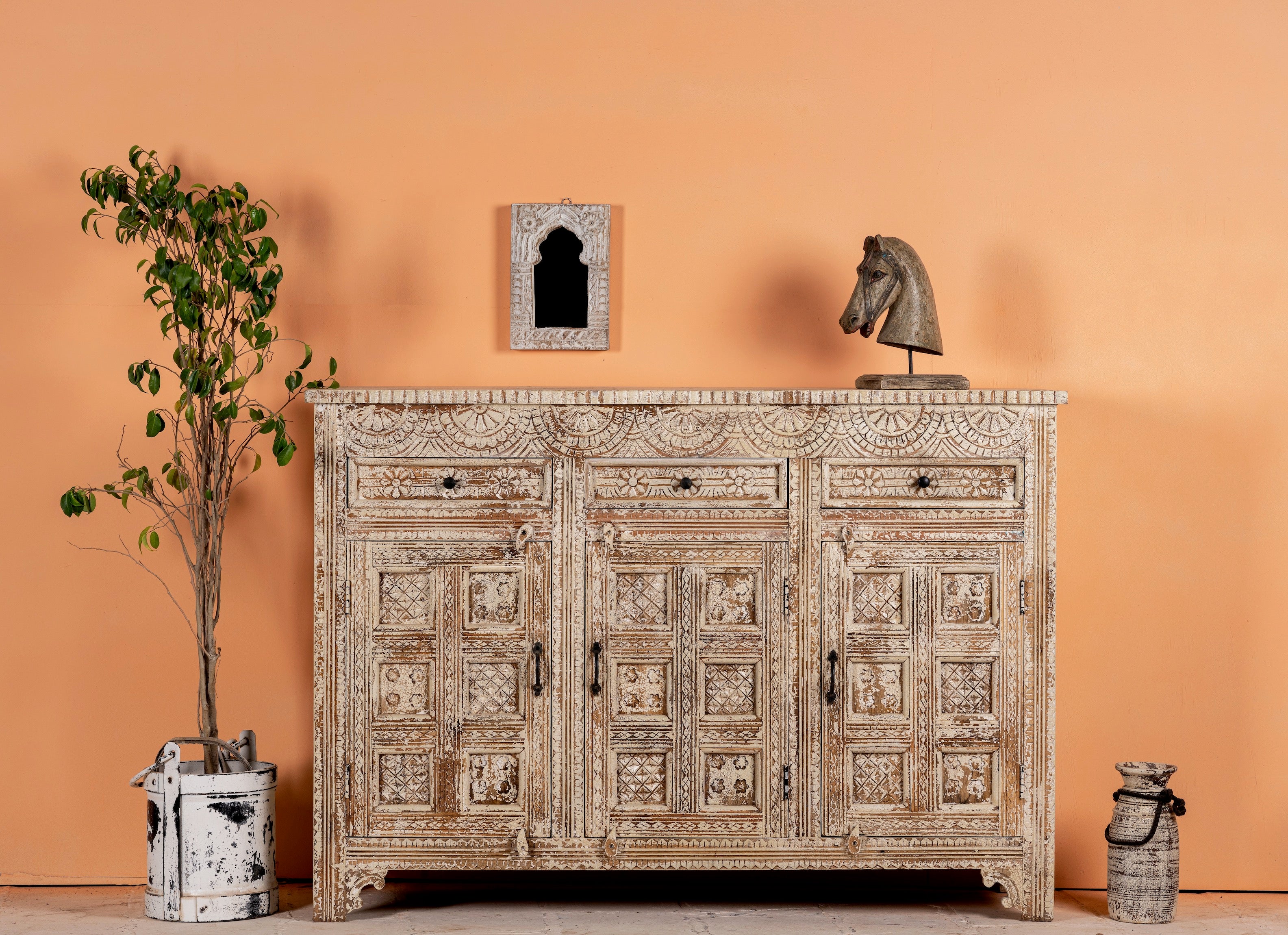 Hand-carved mango wood cabinet with three drawers and vintage distressed finish; ideal for mango wood furniture lovers and vintage home decor, 150 × 110 × 40 cm.
